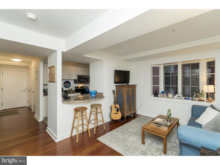 Walk out your front door onto Rittenhouse Square! Spacious 1 bedroom, 1 bath in the highly coveted Parc Rittenhouse offering an open concept floorplan and a large bay window overlooking the building's landscaped courtyard. The kitchen has contemporary cabinetry, granite countertops, stainless steel appliances, and a breakfast bar open to the living room. The bathroom is appointed in marble with an oversized vanity and shower/tub. The spacious bedroom offers ample closest space. There is a stackable washer/dryer, as well as hardwood floors and generous storage space throughout.  Residents of Parc Rittenhouse enjoy 24 hour doorman and concierge, a state-of-the-art fitness center, rooftop pool club, media room, and garage parking below the building for an additional fee. Parc Rittenhouse is located on the east side of Rittenhouse Square which is ranked the 6th best neighborhood in North America. There are over 175 restaurants and 199 retailers within a three block radius. The building is within close walking distance to the Market Street office corridor, Avenue of the Arts and University City. 30th Street Station and Philadelphia International Airport are only minutes away.