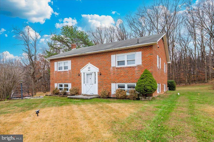 Experience refined country living just minutes from vibrant downtown Frederick. Set on a peaceful stretch surrounded by nature, this brick split-level home offers an exceptional blend of comfort, privacy, and modern convenience.

Inside, the upper level features radiant flooring with both heating and cooling capabilities, creating an elevated year-round living experience. Sun-filled living and dining spaces flow seamlessly toward the screened-in back deck, where you can unwind and savor panoramic views of the serene landscape.

The beautifully refreshed lower level expands the home’s versatility, showcasing a fully remodeled luxury full bath, generous living space, and direct walk-out access—ideal for guests, relaxation, or an elevated entertainment area. A one-car garage provides practical convenience while maintaining the home’s clean, streamlined aesthetic.

As an added benefit, this offering includes a separate additional parcel, delivering enhanced privacy, future expansion potential, or long-term investment flexibility (buyer to verify). 

For those seeking a residence that combines rural tranquility with effortless access to Frederick’s shops, dining, and commuter routes, this home presents a rare and compelling opportunity.