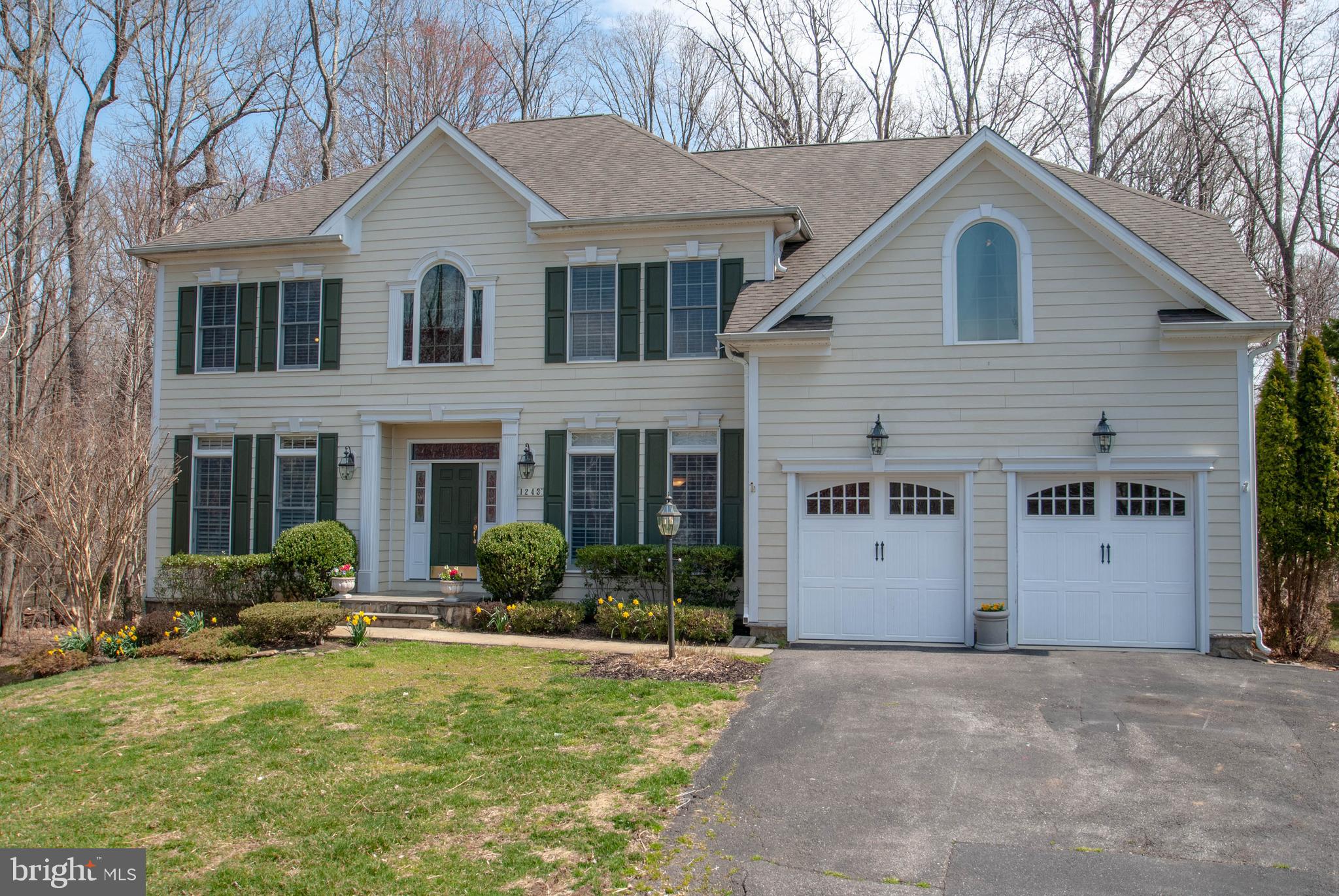 When you drive up to this gorgeous 5300+ square foot home, you will probably notice that it is not only the biggest house in the neighborhood, but it sits on a prime lot as well. Characterized by its privacy and spacious open floor plan, this house is perfect for entertaining inside and out. The first floor boasts a gourmet kitchen with walk-in pantry, formal dining, dedicated office, and formal living room with custom built-ins. Travelling up the grand staircase, you will find four large bedrooms, two with attached baths and one jack and jill bathroom, and a master suite with sitting room and tray ceiling. The master bath stuns with Travertine marble bath, granite counters, and a walk-in closet. The surprisingly large finished basement is where the fun really begins, with a second kitchen/bar area, a work-out area, full bath, and another living room perfect for an entertainment system. Heading outside, the spaces for entertaining continue with an outdoor living area complete with a hot tub and finished deck, all encompassed in a private wooded area. Also listed for sale MDAA395006