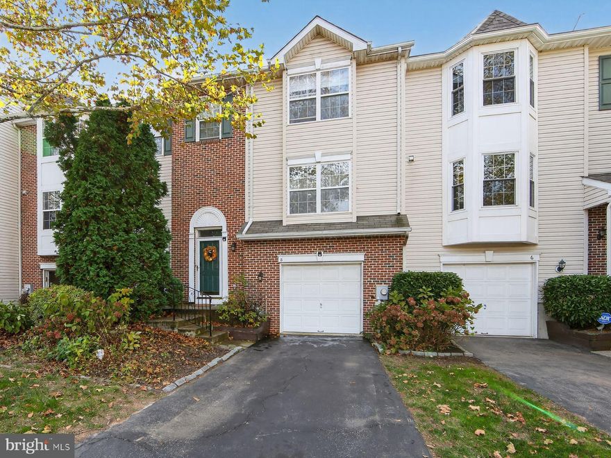 Welcome to 8 Hunt Club Drive in Collegeville! This beautifully maintained interior townhome offers 3 bedrooms, 2.5 bathrooms, and an attached 1-car garage in a desirable community setting. Step inside to find a bright and open floor plan featuring beautiful oak floors in the foyer and bamboo floors on both the main and upper levels. The kitchen is a true highlight with granite countertops, an island for additional counterspace and storage, and plenty of cabinetry—perfect for cooking and entertaining. The stainless steel refrigerator, dishwasher, range and microwave/hood units are all just 5 years old.  A sliding glass door off the kitchen leads to a sunny and updated composite deck, ideal for outdoor dining and relaxing. The main floor also includes a convenient laundry area with a 1 year old washer and dryer included. Upstairs, the spacious primary suite offers a walk-in closet and a private ensuite bath, along with two additional bedrooms and a full hall bath. The finished lower level provides a versatile family room space with newer laminate flooring, and a walkout to the rear common area, offering even more room to relax or entertain. Updates include newer carpeting on the stairs between the main and upper levels, roof in 2011 (per previous disclosure when bought), water heater in 2020, tub and toilet replaced in hall bath, toilets replaced in primary bath and powder room.  Windows were replaced in the basement, kitchen, both rear bedrooms and the primary bathroom.  The sliding glass door was replaced in the basement.  Paint has been touched up throughout the home as well.  Conveniently located near shopping, dining, and major commuter routes, this home perfectly combines comfort, style, and convenience—ready for you to move right in and enjoy!  Be sure to stop in and check out this move-in ready home!