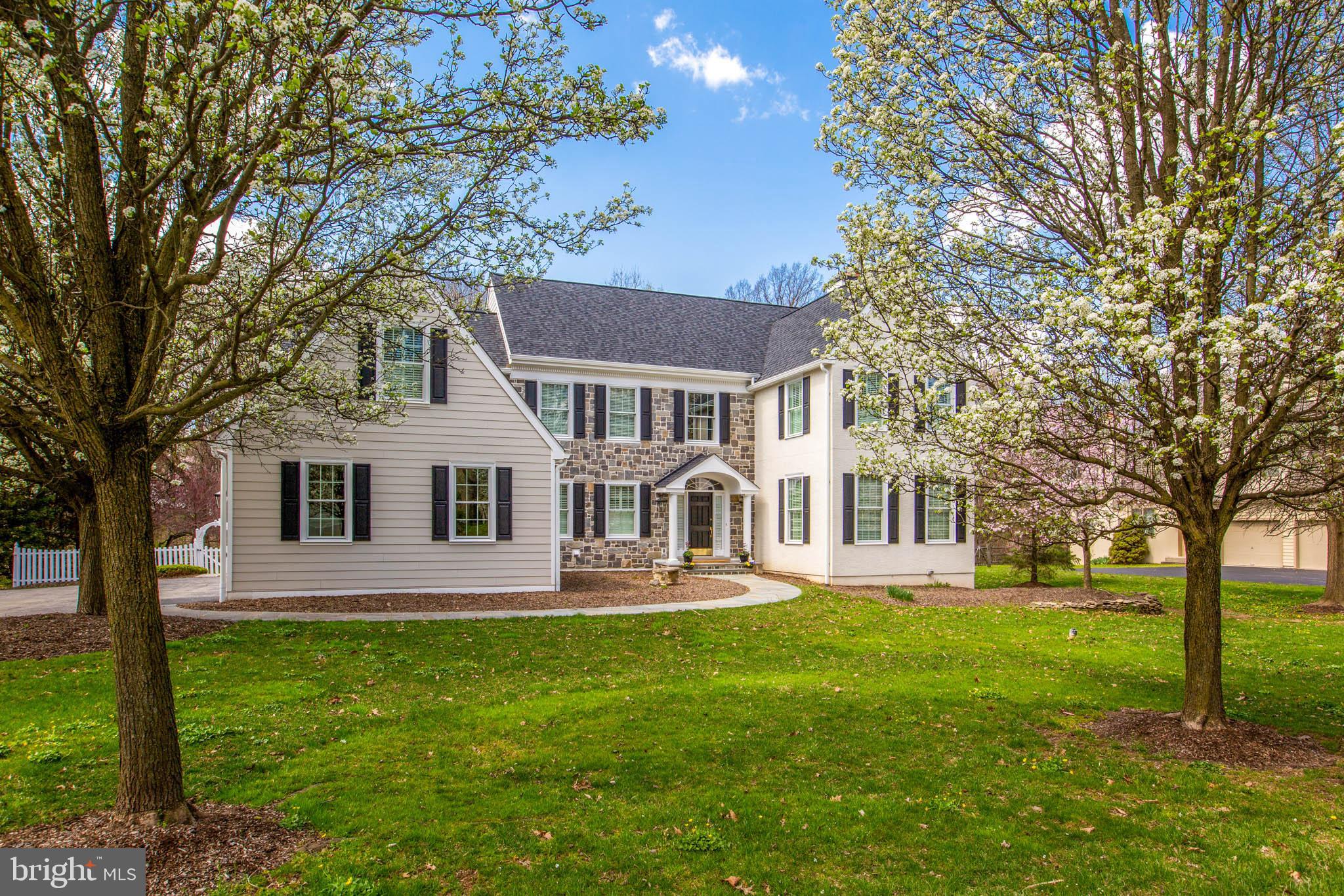 Wow! This is a must see. Pictures don't do it justice. Located in Treyburn, a highly desirable neighborhood in Tredyffrin/Easttown, one of the top school districts in the state, this is a beautiful four bedroom, three full, two half bath home. It has been meticulously maintained and tastefully updated inside and out. This is the first time this lovely home has been listed for sale. It is on a premium flat lot that backs up to quiet wooded open space. This picturesque setting doesn't come on the market often. The foyer is a dramatic two story entrance to this exquisite home. There are beautiful hardwood floors throughout the first floor. Enter into the living room with elegant fireplace and marble surround. The separate study is a private and quiet space to work or relax. Walk into the light filled dining room with amazing wall of windows with views of the attractive landscape. Enter into the light filled kitchen with oversized island and scenic views of the pool. The well equipped kitchen opens up to the family room with high ceilings, with gorgeous two story fireplace and built-in cabinetry. The open concept kitchen and family room offers a fabulous layout for entertaining. The backyard offers family and friends an amazing heated pool, spa and gazebo and expansive deck for relaxation and fun. Convenient back staircase next to the custom built cubbies, a second powder room, nearby first floor laundry room with custom cabinets. A great arrangement for busy families! The Master Suite is a tranquil and spacious retreat. It is separated from the other bedrooms and it has a double door entry, gorgeous lighting, tray ceiling and crown molding. The new spa like bathroom has an oversized seamless shower and free standing tub, custom cabinetry, lighting and more. The show-stopping his and her custom closets are elegant and exceptional. There are three generously sized bedrooms, one of which has an en suite bathroom. There is another full bathroom. All three bedrooms have custom closets. One of the bedrooms has a wonderful finished sitting room/bonus room. The basement is superb for families. It has high ceilings, a custom bar, fireplace, workout room/playroom with expansive closet storage, media area, large separate storage room. This home has great curb appeal with mature flowering trees that line the street and frame the house and yard. Note: Every speck of original stucco has been removed and the house was completely rewrapped. Other features include all new Pella windows, newly painted inside and out, new gas furnace, new hot water heater, newer A/C, new carpet, newer hardwood, new security system, new outdoor light fixtures, new walkway, new garage doors, new roof, new stone, Hardie plank and more. Immaculate condition! It's all about location and this home is less than five minutes from the train, 76,202, 422, turnpike, King of Prussia mall, the new King of Prussia Town Center and the new Chester Valley Trail. Treyburn is notable for being developed on the site of a former tree nursery. It is unsurpassed in its beauty of mature and majestic trees and landscaping and has its own paved walking/jogging path with over two miles of natural beauty. Schedule your appointment soon as this home won't stay on the market for long.