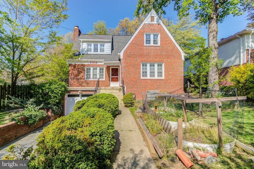 Enchanting, expansive Tudor with abundant light, oh-so-many spaces for you and yours. Living room with fireplace. Spacious kitchen. Formal dining room. Pair of main level bedrooms allow for flexibility of use. Upper level features a primary suite worthy of the name, including sitting area, study, and dressing room, met with large vintage-inflected bath, additional pair of bedrooms, laundry chute. Downstairs you’ll find a capacious rec room and au pair suite with its own kitchen, ideal for guests or longer-term conjoined living. Well-maintained lot and gardens include patio overlooking places to play and entertain. It’s all here! On iconic Takoma Park street, though just outside the municipality & taxes,  just steps to Long Branch trail, parks & playgrounds, shops, crossroads farmers market, and transit, including forthcoming purple line station.