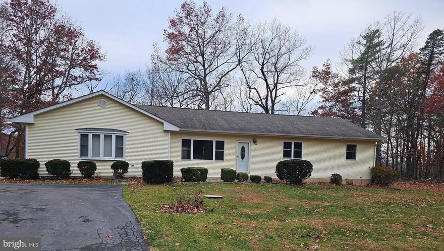 This beautiful and meticulously maintained 3 bed 3 bath home with attached 2 car garage is available to lease. Nestled on a spacious lot, this property offers sanctuary, featuring a private paved driveway, clear and flat front yard and backs to wooded lot. Enjoy the comfort and ease of single level living. Modern Kitchen with island, plenty of cabinet space and a gas stove. Main bedroom features fully updated bathroom and private access to a spacious rear deck. 2 additional bathrooms in the home means no traffic jams with family or guests.  Oversized two car garage to keep your vehicles out of the weather with direct access to the living area making it easier to step into comfort. Gas log fireplace insert located in the living room to keep everyone warm and cozy or just provide some ambiance. Pets considered on a case by case basis. No smoking. Tenant responsible for water softener system lease, electric, and propane.