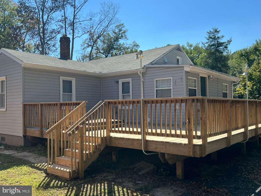 This beautifully updated 1-level rental home apartment features gorgeous hardwood floors, a modern gally-style kitchen with granite countertops, and stainless-steel appliances on a spacious 1+ acre lot. The electric and water utilities are included in the rent along with lawn care. There is also a lovely front porch and backyard deck for outdoor enjoyment. Be sure to schedule your appointment soon because this all-inclusive property will not last long!