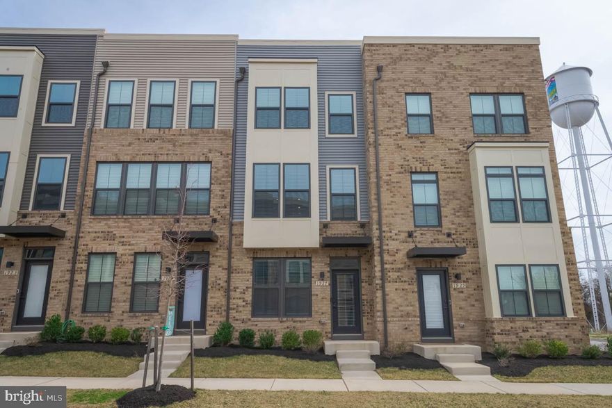Welcome to this meticulously maintained Clarendon Urban 4-Story townhome, built just 2 years ago and scarcely lived in since. While Ryan Homes continues to construct new residences at Foundry Station, this practically new home is MOVE-IN  ready, eliminating the wait associated with new builds.
Upon entering the main level, you'll find a spacious bedroom complemented by a full bathroom, ideal for guests or a private home office. This level also provides access to a generous one-car GARAGE.
The 2nd level serves as the heart of the home, featuring a gourmet kitchen equipped with Downing Duraform Espresso cabinetry, granite countertops, and a double bowl under-mount sink with an upgraded faucet. The kitchen is complemented by a stylish tile backsplash, under-cabinet lighting, and GE Stainless Steel appliances, including a side-by-side refrigerator, double-oven convection range, microwave, and dishwasher with hidden controls. Luxury vinyl plank (LVP) flooring extends throughout the kitchen and dining area, creating a cohesive and elegant space. Adjacent to the dining room, sliding glass doors open to a 7x14 cantilevered DECK, perfect for outdoor dining and entertaining. The living room, with plush carpeting, offers a comfortable retreat for relaxation. A conveniently located powder room completes this level.
Ascending to the 3rd level, the primary suite awaits, featuring a spacious bedroom, a full ENSUITE bathroom with modern fixtures, and a generous walk-in closet. This floor also hosts an additional bedroom, a full hallway bathroom, and a laundry area, ensuring convenience and functionality.
The 4th level offers a versatile LOFT area, perfect for a secondary living space, entertainment hub, or home office. This level also includes a fourth bedroom and full bathroom, providing privacy for guests or family members. Step outside to the expansive 15x10 rooftop TERRACE, offering panoramic views and ample space for outdoor gatherings or tranquil relaxation.
Additional features of this exceptional townhome include electrical upgrades such as two TV pre-wires, dual cable and internet ports, two ceiling fan rough-ins, and six LED recessed lights, ensuring modern connectivity and comfort. Smart home integrations like a Wi-Fi-enabled smart thermostat and garage door opener enhance convenience and energy efficiency.
This barely lived-in townhome presents a unique opportunity to own a contemporary residence that seamlessly blends LUXURY, convenience, and modern amenities in a prime location.