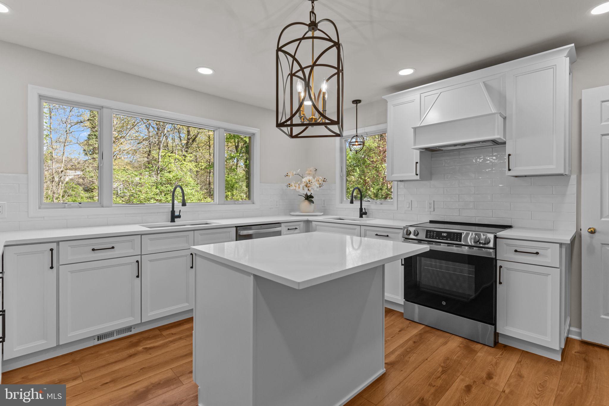 Stunning 5-Bedroom Colonial with High-End Renovations & Dream Kitchen
Welcome to this beautifully updated 5-bedroom, 2.5-bath, two-story Colonial nestled in a serene, private setting. This spacious home offers the perfect blend of timeless character and modern upgrades, featuring a brand new roof, gutters, siding, windows, water heater, and newer AC unit for worry-free living.
Step inside to find solid oak hardwood floors throughout most of the home, with thoughtful touches in every room. The heart of the home is a newly renovated custom-designed kitchen that’s straight out of a magazine. Enjoy quartz countertops, subway tile backsplash, two full-size sinks, custom lighting, a stunning center island with microwave niche, stylish white cabinetry with soft-close drawers, and both island and peninsula seating. Wide plank luxury vinyl oak flooring ties it all together, and upgraded Andersen with Tru screens picture windows flood the space with natural light.
The spacious family room boasts a cozy wood-burning fireplace, exposed custom beams, and a new sliding door that opens to a spacious rear wood deck—ideal for entertaining or relaxing.
Designed for convenience, the home includes two laundry rooms—a ceramic-tiled first-floor laundry/mudroom combo, and a second-floor laundry area with luxury vinyl flooring and 12x14 storage access.
As you make your way upstairs there is an extra wide solid wood beautiful stairwell with wrap around banister with matching hardwoods to all five bedrooms including closets. The primary suite features, built-in cabinetry, a walk in closet, and access to a massive 12x15 storage area. The en-suite bath is newly renovated with a walk-in shower, modern tile, and a double vanity. Four additional bedrooms—one with bonus built-in cabinetry——provide room for family, guests, or work-from-home flexibility.
The charm continues outside with a large front porch, fully redone driveway, and lush, mature landscaping offering privacy and curb appeal. A side-entry 2-car attached garage adds functionality. The first floor powder room has been upgraded with brand-new penny tile flooring, custom cabinetry, a quartz countertop, and stylish new fixtures.
The finished basement is freshly painted and includes custom built-ins—ideal for a rec room or home office office along with a separate workshop/storage area.
Freshly painted throughout including doors, trim, and ceilings, this turn-key home truly has it all. All major components updated including roof, siding, windows, hardwood floors throughout, freshly painted and so much more.
Don’t miss the chance to own this meticulously maintained home by its original owners.—schedule your private tour today!