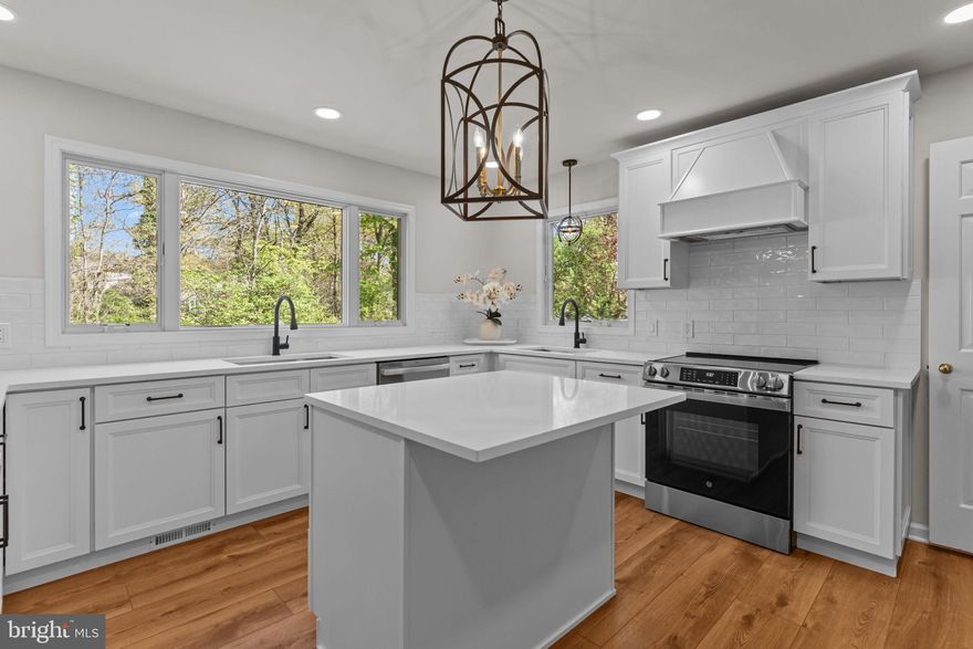 Stunning 5-Bedroom Colonial with High-End Renovations & Dream Kitchen
Welcome to this beautifully updated 5-bedroom, 2.5-bath, two-story Colonial nestled in a serene, private setting. This spacious home offers the perfect blend of timeless character and modern upgrades, featuring a brand new roof, gutters, siding, windows, water heater, and newer AC unit for worry-free living.
Step inside to find solid oak hardwood floors throughout most of the home, with thoughtful touches in every room. The heart of the home is a newly renovated custom-designed kitchen that’s straight out of a magazine. Enjoy quartz countertops, subway tile backsplash, two full-size sinks, custom lighting, a stunning center island with microwave niche, stylish white cabinetry with soft-close drawers, and both island and peninsula seating. Wide plank luxury vinyl oak flooring ties it all together, and upgraded Andersen with Tru screens picture windows flood the space with natural light.
The spacious family room boasts a cozy wood-burning fireplace, exposed custom beams, and a new sliding door that opens to a spacious rear wood deck—ideal for entertaining or relaxing.
Designed for convenience, the home includes two laundry rooms—a ceramic-tiled first-floor laundry/mudroom combo, and a second-floor laundry area with luxury vinyl flooring and 12x14 storage access.
As you make your way upstairs there is an extra wide solid wood beautiful stairwell with wrap around banister with matching hardwoods to all five bedrooms including closets.  The primary suite features, built-in cabinetry,  a walk in closet, and access to a massive 12x15 storage area. The en-suite bath is newly renovated with a walk-in shower, modern tile, and a double vanity. Four additional bedrooms—one with bonus built-in cabinetry——provide room for family, guests, or work-from-home flexibility.
The charm continues outside with a large front porch, fully redone driveway, and lush, mature landscaping offering privacy and curb appeal. A side-entry 2-car attached garage adds functionality.  The first floor powder room has been upgraded with brand-new penny tile flooring, custom cabinetry, a quartz countertop, and stylish new fixtures.
The finished basement is freshly painted and includes custom built-ins—ideal for a rec room or home office office along with a separate workshop/storage area. 
Freshly painted throughout including doors, trim, and ceilings, this turn-key home truly has it all.  All major components updated including roof, siding, windows, hardwood floors throughout, freshly painted and so much more.
Don’t miss the chance to own this meticulously maintained home by its original owners.—schedule your private tour today!
