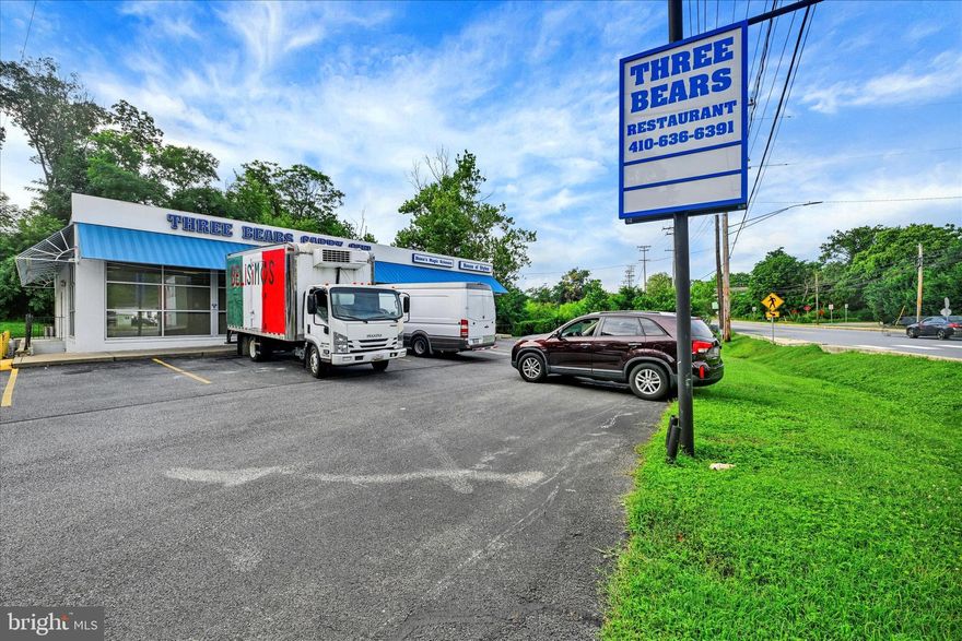 Incredible investment opportunity in a high-traffic corridor! This ±3,500 SF commercial plaza is situated on busy Annapolis Road (MD-648) with an estimated traffic count of over 20,000 vehicles per day, offering prime visibility and excellent signage potential. Located just minutes from I-695, I-95, and downtown Baltimore, this location benefits from steady commuter and local traffic, making it ideal for a variety of businesses.

The plaza is anchored by a large restaurant space—formerly home to the popular "Three Bears Carryout"—which underwent a full renovation in 2016 or 2017. The restaurant space is currently vacant and move-in ready, offering an immediate opportunity for a new tenant or owner-operator. The remaining two main-level units are fully leased to a long-standing hair salon and a barber shop, both with established client bases.

Additionally, there's a lower-level space with potential to be converted into a fourth income-generating unit, further increasing the property’s cash flow. Whether you're an investor looking for stable income or a business owner seeking a highly visible location with built-in foot traffic, this property checks all the boxes.

Don't miss your chance to own a multi-tenant retail center in a growing area with strong demographics and unbeatable access. Schedule your tour today!