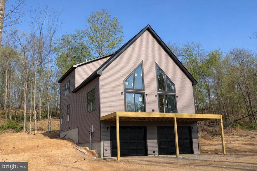 Discover the perfect blend of modern comfort and serene privacy in this beautifully crafted new construction chalet, nestled on 3+ wooded acres. This thoughtfully designed home offers a unique and functional layout ideal for both everyday living and weekend getaways.
The upper level features two spacious bedrooms and a full bathroom, providing a cozy retreat with peaceful wooded views. On the main level, you’ll find the primary bedroom along with private bathroom, and a half bathrooms, offering convenience and flexibility for guests or single-level living.
The heart of the home is the stunning kitchen, complete with a full 4-piece stainless steel appliance package, sleek granite countertops, and ample cabinetry—perfect for entertaining or preparing everyday meals.
The basement includes an additional half bathroom and finished rec room that offers great potential for future finishing or extra storage space.
Surrounded by nature, this property provides the privacy and tranquility you’ve been looking for while still offering the benefits of brand-new construction.
Don’t miss your opportunity to own this beautiful chalet retreat!