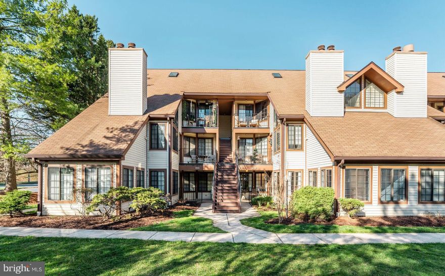 OPEN SATURDAY 11-1, AND SUNDAY 2-4!! Nestled in a courtyard, this main-level unit has a generous layout and open floorplan with tons of natural light! Features of this unique unit include: hardwood floors, chair rail, fresh custom paint throughout; as well as a wood-burning fireplace with heatilator. The kitchen features a breakfast bar, pantry, BRAND NEW quartz countertops, sink and faucet; and updated appliances. The front-loading Washer and Dryer were just replaced last year! The full bath has been updated with a new vanity. The primary bedroom features a large closet with a customizable storage system. The second bedroom has an incredible vaulted ceiling! All the rooms - as well as the private gated patio - have courtyard and garden views. 

Manchester Lakes Community residents enjoy beautiful common grounds with ponds and mature trees, as well as a clubhouse, fitness room, an outdoor pool, trails and picnic areas. Sport courts include pickleball, tennis, and basketball. This unit has one assigned parking space, right next to the sidewalk leading to the courtyard entry. Amazon Fresh, Home Sense, and many more shops and restaurants are right around the corner at the Festival at Manchester Lakes shopping center.  Commuting options include a bike share one block away, Metro and Fairfax Connector bus stops, and it is just over a mile to the Francoinia-Springfield Metro/VRE stations.