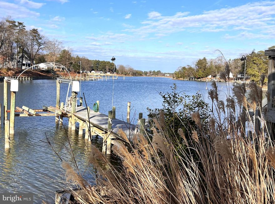 Tucked along the quiet waters of Cob Creek, this waterfront retreat captures the easy rhythm of life on Virginia's Northern Neck. Sheltered, scenic and naturally private, the setting offers calm creek waters ideal for kayaking, paddleboarding, fishing and crabbing with quick access to the Great Wicomico River and the Chesapeake Bay beyond. The home is thoughtfully positioned to take in wide water views and outdoor spaces for lingering-morning coffee by the creek, afternoons on the dock and evenings watching the boats drift by. Whether you're looking for a full-time residence or a weekend escape, this Cob Creek property delivers the kind of waterfront lifestyle that keeps generations coming back to the Northern Neck-unhurried, authentic and rooted in the waters. This home on 0.78 acres offers you the choice of single level living with a finished basement for rental opportunity and additional income to offset your mortgage. Buyer to confirm with county the status on upgrading the current septic system if so desired to increase any potential for extra bedrooms. Open concept kitchen, dining and living room space with beautiful views of Cob Creek. Large deck, private dock as well as community amenities of pool, tennis courts, boat ramp and playground for a nominal fee of $135 annually.  The property also includes a 2-car garage and a separate outdoor structure for additional storage. Property is being sold As-Is with no known defects