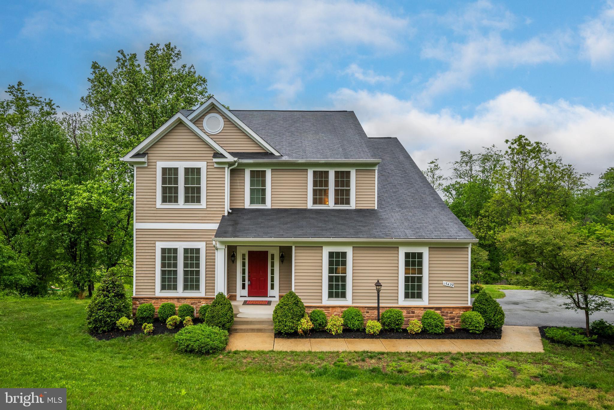 Amazing opportunity to find a like-new home at this price in Western Howard County! Welcome to Rivercrest. A lovely enclave of 12 homes on and surrounded by rolling hills and encircled by Cattail Creek, non-buildable forest conservation and open space. Nestled in the hillside, embrace the quiet and admire the protected view. Enter the large foyer flanked by a generous front office away from the conversation and a perfect oasis for those who work from home. As you make your way into the heart of the main floor you will be amazed by a breath-taking wall of windows extending from the living room with gas fireplace to the large open dining room to the peaceful built-in corner work or craft space. The magnificent kitchen is command central as the generous breakfast bar/island separates from the living space while the open floorplan welcomes multiple work stations and an unobstructed view . An abundance of cabinetry, granite counters, indirect lighting above, gourmet stainless appliances, walk-in pantry and separate reception area from the over-sized side entry garage. Access the upper level by a hidden split stairway to find a large center hall, 4 spacious bedrooms each with a private walk-in closet. The primary bedroom suite is large enough for a sitting area; spa bath with double vanity, soaking tub, shower stall and twin walk-in closets. The hall bath perfectly separates service spaces; tub/shower and w/c are private from large vanity. An amazing laundry room is tucked at the end of the hall with service tub, ample space for drying rack, a folding table and ironing/craft space. The finished lower level with large storage/utility room, wall of double hung windows and sliding glass door walk-out to the rear yard. Multi-space for gym, entertainment, powder room, secondary office or future 5th bedroom with walk-in closet and ensuite access to the powder room including rough-in for future shower. This hidden treasure is minutes from Rt. 97 offering easy access North to Rt. 70 and South to the ICC; and, of course all that Howard County has to offer. Western Regional Park, Senior Center and Library complex, nearby shopping and restaurants, plus minutes to Glenelg, Glenwood and Bushy Park schools. Welcome Home!