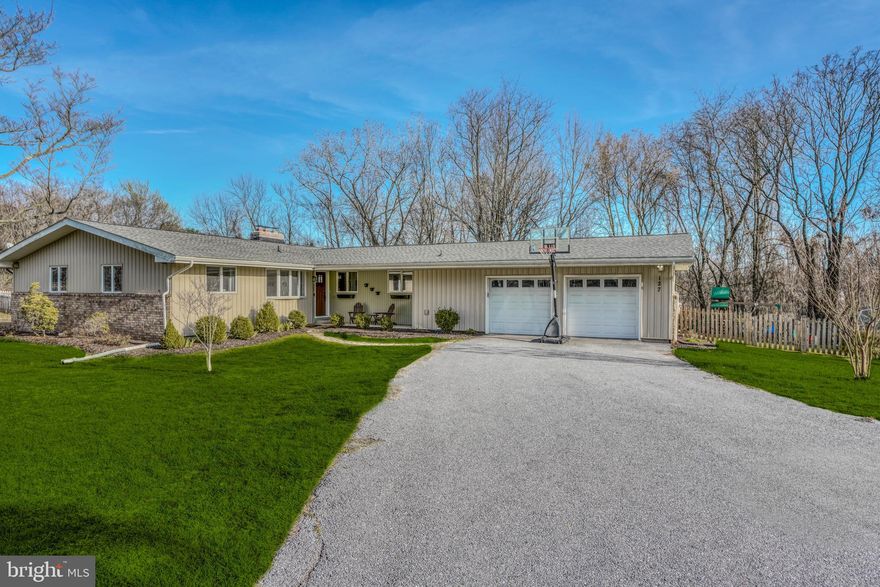 Charming contemporary rancher on one acre private lot.  Bamboo hardwood floors on main level, Updated kitchen with walkout to rear deck and open to family room. Living room has gas fireplace, 3 main level bedrooms including main bedroom with en suite full bath and additional hall full bath. Finished walkout level basement with large rec room and second gas fireplace. 2 car garage. This property includes 2 parcels, totaling .94 acres. Parcel #2400009067 is .695 acres, and Parcel #2400009068 is .246.