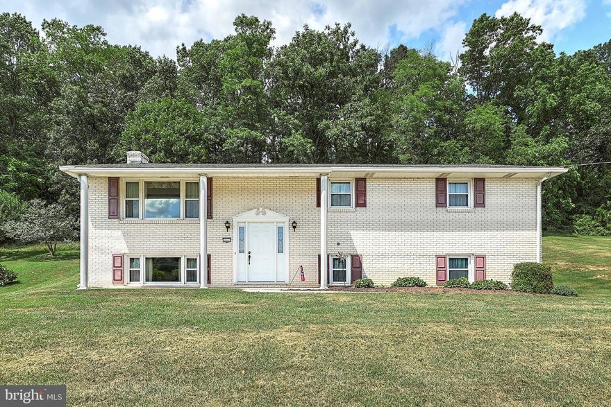 Lovingly maintained by one owner for over 50 years! This split-foyer in Glen Rock is waiting for you to make it your own. On the main floor of the home, you'll find the kitchen, a comfortable living and dining area, three bedrooms, a full bathroom, and the added convenience of main floor laundry! Additionally, off of the kitchen you'll find a large screened-in sunroom, perfect for entertaining, relaxing or nature watching. The lower level has a generously-sized family room, with fireplace, and an additional bedroom and full-sized bathroom. Last, but not least, this home comes with a 2-car garage, perfect for storage or workshop endeavors. Sitting on a sprawling .87-acre plot, the outdoor space promises endless potential for landscaping dreams or recreational activities.  Don't miss the opportunity to make this Glen Rock gem your very own! Schedule your showing today.