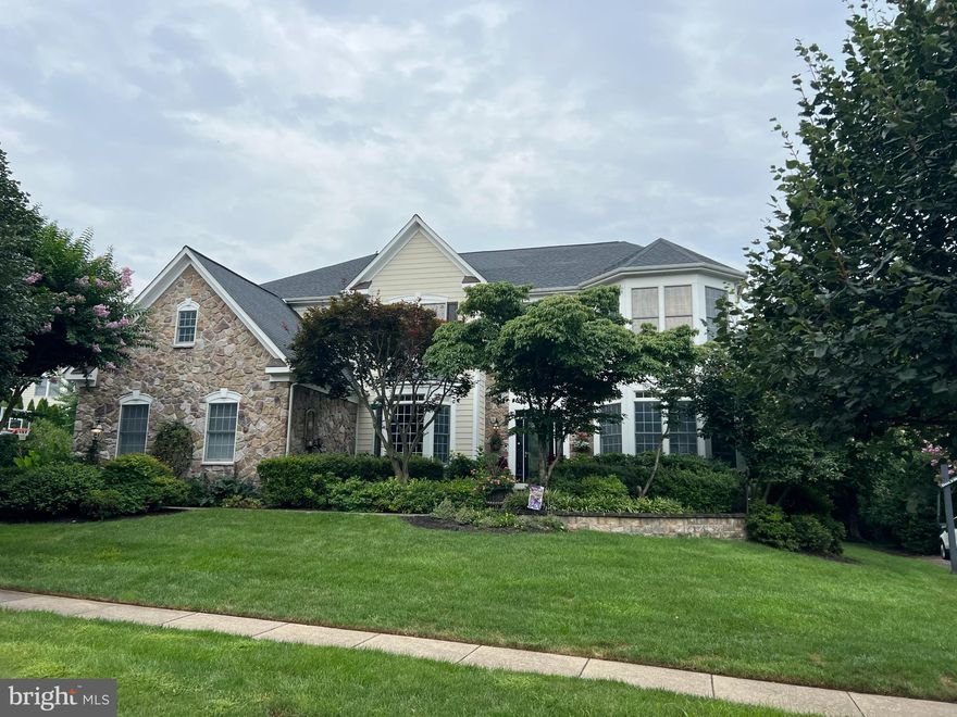 Nestled on a Quiet Cul-De-Sac in the Prestigious Lansdowne on the Potomac Community, this Exquisite Residence Offers a Harmonious Blend of Luxury and Comfort-Spanning Nearly 7,000 Square Feet, Designed for Both Relaxation and Entertaining- Featuring a Wide Open Main Level Layout with Two Large Family/Living Rooms Opening to the Kitchen-The Kitchen Features a Custom Island, Updated Stainless Appliances and Abundant Storage and Workspace-The Upper Level Includes a Owner's Suite fir for a King with Oversized Closets, a Private Exercise Room and a Renovated Spa Inspired Owner's Bath-The Secondary Bedrooms are Ample in Size and All Connected to a Full Bath-The Lower Level Was Recently Finished with the Highest Level of Finishes and Attention to Detail- The Space Includes a Gorgeous Rec Room, Home Theater, Wet Bar, Over the Top Custom Bath, Wine Cellar, Game Room and More-The Exterior Captivates with its Stunning Stone Accents and Meticulously Maintained Landscaping and Oversized 3-Car Garage-The Grand Covered Porch Looks Over the Backyard of the Property, Providing a Sophisticated Outdoor Space Perfect for Gatherings or Quiet Evenings Under the Stars. The Community Amenities Elevate the Resort Style Living, Featuring Multiple Pools, Tennis Courts, and a State-of-the-Art Fitness Center. Enjoy Leisurely Strolls Along the Scenic Jog/Walk Paths or Unwind at the Recreation Center, all Within a Vibrant Neighborhood that Fosters a Sense of Community. This Home is Not Just a Residence; it's a Lifestyle Choice, Where Luxury Meets Everyday Comfort in a Serene Setting. Experience the Perfect Blend of Sophistication and Warmth in this Exceptional Property.