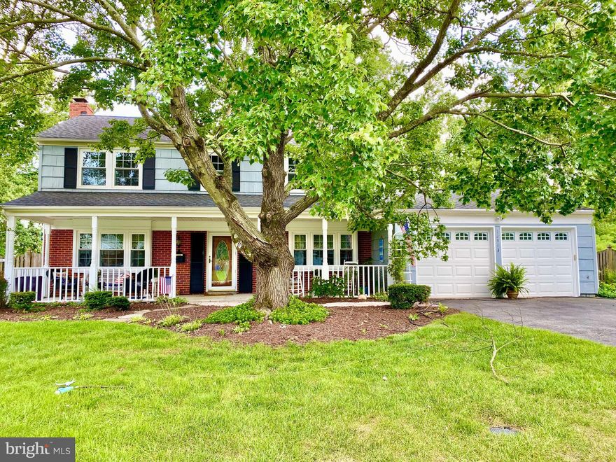 Welcome to your new home nestled on a tree-lined street  just minutes from Washington D.C., Annapolis, Baltimore, and Fort Meade! This stunning single-family colonial features four spacious bedrooms, two full baths, plus a half bath on the main level. Sit in the shade on the large front porch in your rocking chairs and listen to the whispering of the leaves in the breeze under the maple trees while sipping your morning coffee. Soak any stress away in the private hot tub and spa after eating lunch on the expansive deck just off the family room addition. The sunny and bright updated kitchen boasts a penny tile backsplash, white shaker cabinets, and stainless steel appliances, including a double oven for your holiday cooking. Once dinner is ready, taste your delicious meal with loved ones in the formal dining room that has plenty of space for a 12+ seat farm-style table, while enjoying the sound of the crackling wood burning in the fireplace. A separate office just off the kitchen and foyer is perfect for catching up on emails or a homework study zone. Gather everyone for a football game in the substantial family room addition, complete with a wood stove and loads of natural light from expansive windows looking out to the fenced backyard.  A 2-car garage connects to the laundry and mudroom to kick off your boots. Park your extra "toys" in the extended driveway. When the weather is hot or cold, the energy efficient thermal windows, natural gas heat, and professionally maintained temperature control systems keep the house just right. You will delight in the perfect blend of classic charm and contemporary comforts in every corner of this meticulously maintained property. Plus, the community offers an optional pool membership, the Bowie Golf Club within walking distance, public transportation, shopping and numerous parks nearby.
