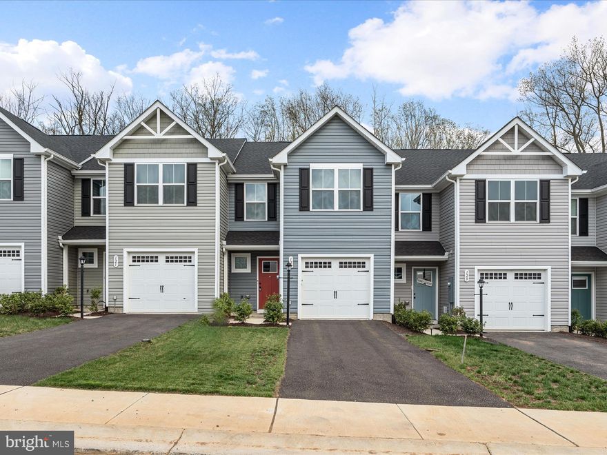 Welcome to this beautifully maintained, nearly new interior townhouse in the desirable Carinal Pointe community. Featuring 3 bedrooms and 2.5 bathrooms, this home offers comfort and convenience throughout. The main level boasts a carpeted living room, a stylish half bath, and a well-appointed kitchen complete with an island, sleek black appliances, and an adjacent dining area with a sliding glass door leading to the backyard. Upstairs, you’ll find a warm and inviting layout, a convenient laundry area, and a cozy primary suite with a walk-in closet and private bathroom featuring a dual vanity. Enjoy the ease of a 1-car garage, neighborhood sidewalks, and a move-in-ready feel that makes this townhouse a true gem.