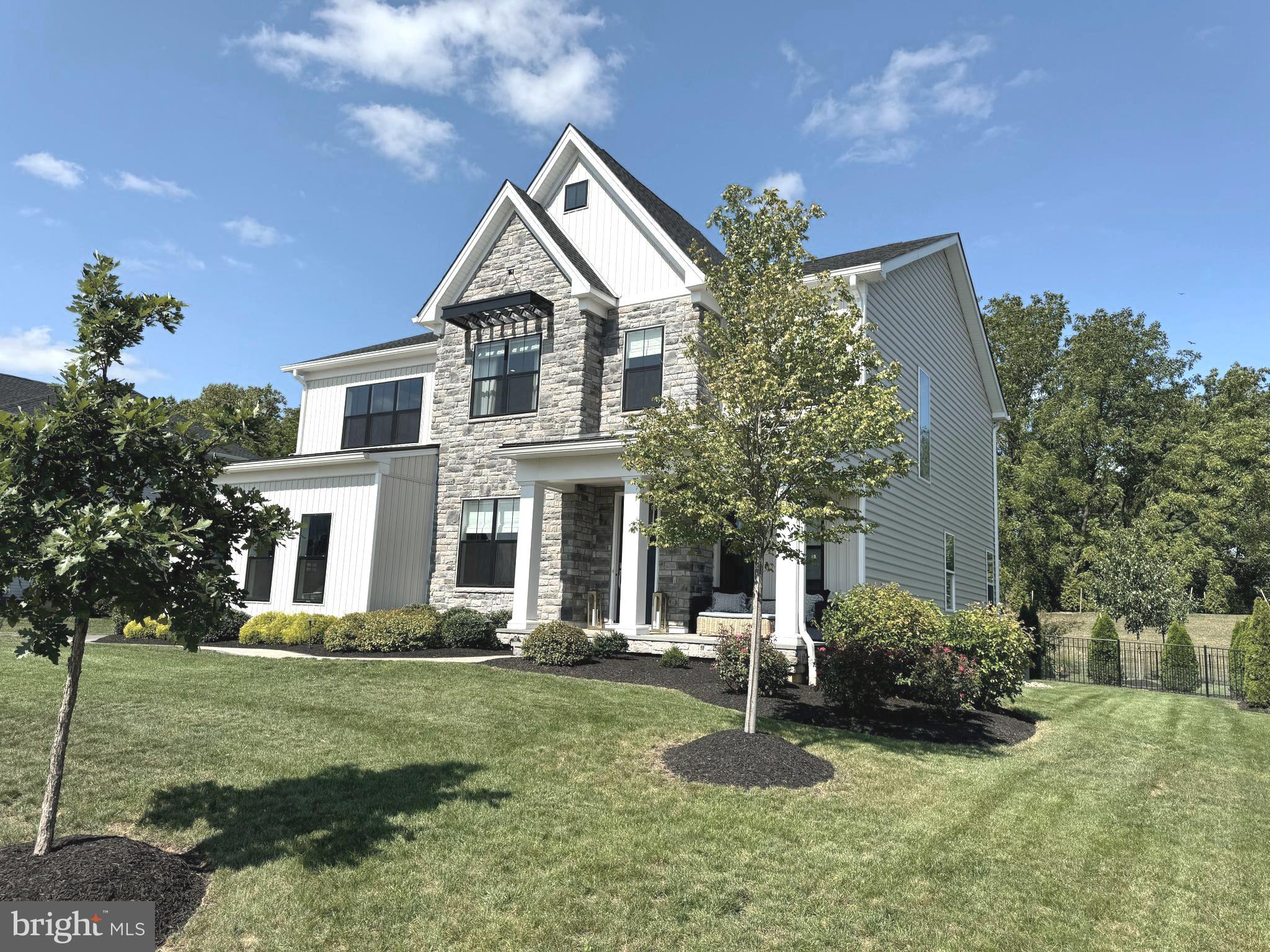 Better than new, this 2-year young beautifully upgraded home with every bell and whistle imaginable is on the market in the desirable Reserve at Center Square community in the Methacton School District – and it’s ready for a quick delivery!! This home has $345,000 in builder upgrades and another $200,000+ in upgrades by the current owner – it truly shows like a model! To build this model with Toll Bros today, your starting price would be $1,385,000 without any of these upgrades!! See upgrade list in the documents section. With the open floor plan, this home is where modern elegance meets practical design. Highlights include the beautifully Finished Basement that includes an in-law suite with sitting area and decorative barn doors and a large rec room; Beautiful millwork including decorative moldings, accent walls, and beams added to the ceiling; Wood floors on 1st and 2nd floors; 10’ ceilings on main floor and 9’ ceilings on 2nd floor and lower level; Customs closets; Custom shades; Upgraded, top of the line light fixtures from Serena and Lily and Ro Cham Beaux; Serena and Lily mirrors in most baths; AND the home is in one of the best locations in the community backing to community open space for great privacy. Outside you will find a back yard oasis full of upgrades that includes a custom pavilion with electric and TV mount, a huge custom patio with built-in BBQ, custom walkways, a hot tub, a play area with rubber chips (playset included), extensive landscaping, decorative black metal fence and sprinkler system; Upon entering the house from the welcoming front porch, you immediately see how special it is with the wide-open floor plan, gorgeous flooring, and beautiful millwork. The Dining room with gorgeous millwork is completely open to the entry hall, Kitchen, breakfast room and family room. The custom kitchen features top of the line Century cabinets, quartz countertops with an elegant waterfall edge, top of the like stainless appliances including Wolf gas range, under cabinet and toe kick lighting, and an expansive breakfast bar that seats 6 with storage below! Off the kitchen in the back of the home is the bright and sunny breakfast room with 3 walls of windows and a door to the back yard. There is a study/office nicely tucked away for convenient working from home! The family room is completely open to the kitchen with a gas fireplace, and tucked away just off the family room is a bonus room perfect for play room or home office. Off the kitchen is a mudroom with a huge, custom pantry closet, and there is a charming powder room with designer wallpaper and a walk-in coat closet off the entry hall. Upstairs you will find a large, versatile loft area with wood floor and numerous windows, two bedrooms that share a Jack and Jill bath (double sink, and separate shower and lav area); a bedroom suite with private bath and custom walk-in closet; a convenient laundry room with an abundance of cabinetry; and the gorgeous primary suite with an expansive custom closet and luxurious bath with two custom vanities, and an oversized, beautifully tiled shower with multiple shower heads. The lower level features an expansive, carpeted rec room, plus a bedroom suite – perfect for in-laws, nanny, or adult children with the private bath, sitting area, and walk in closet! The charming barn doors add beautiful detail to this versatile space. This vibrant community at the Reserve is welcoming to newcomers with plenty of opportunities to meet your neighbors at the monthly block parties, chili cook-offs and holiday celebrations. This convenient location is just minutes from downtown Skippack, and just a short distance to Blue Bell, Lansdale, Plymouth Meeting with a tons of shops and restaurants. There is also great access to 202, 476, and the 276 Turnpike that makes your commute to work a breeze.