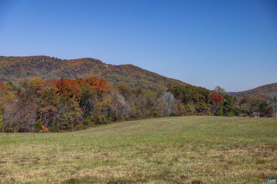 15-acre lot with gorgeous views, surrounded by mountains in southern Albemarle near Covesville.  Rolling pasture, driveway (shared) already in place, soil testing done.  Great location only 15 minutes south of Charlottesville.  Really beautiful pastoral and mountain views.  Lot 1 has 2 division rights, meaning that 2 houses can be built on the property.  Perfect for main house, guest house configuration.   Good opportunity for small horse farm or other small-scale farming endeavor.  In land-use (hay), owner intends to convey that way.
