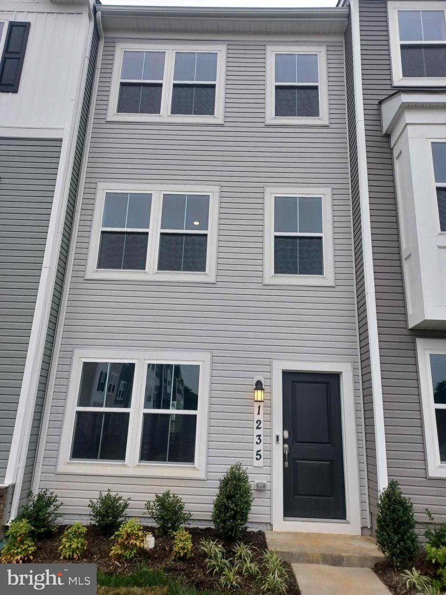 Located in the new homes community of Red Clover Meadows, this new construction townhouse is a true embodiment of modern comfort. Completed in 2025, this residence offers functionality, perfect for those seeking a carefree lifestyle. Situated directly opposite of the future community green space and playground adds to additional outdoor space within steps of your front door. Inside you'll discover a thoughtfully designed interior featuring two spacious bedrooms and two full bathrooms, complemented by two additional half baths for convenience. The open-concept layout invites natural light to flow seamlessly throughout the living spaces, creating an inviting atmosphere that feels like home. The heart of this home is undoubtedly the well equipped kitchen with all appliances and access to the rear deck.  The upper-floor laundry room provides added convenience. With excellent property condition this townhouse is ready for you to move in and make it your own. Parking is provided with an attached garage featuring rear entry, along with additional off-street and parking lot options.  Available for lease starting June 28, 2025, this property offers a minimum lease term of 24 months, allowing you to settle into your new home without the worry of frequent relocations. The surrounding area boasts a tranquil environment, perfect for unwinding after a long day, while still being conveniently located near essential amenities.  This townhouse is not just a place to live; it's a lifestyle waiting to be embraced. Don't miss the opportunity to call this exquisite property your home.