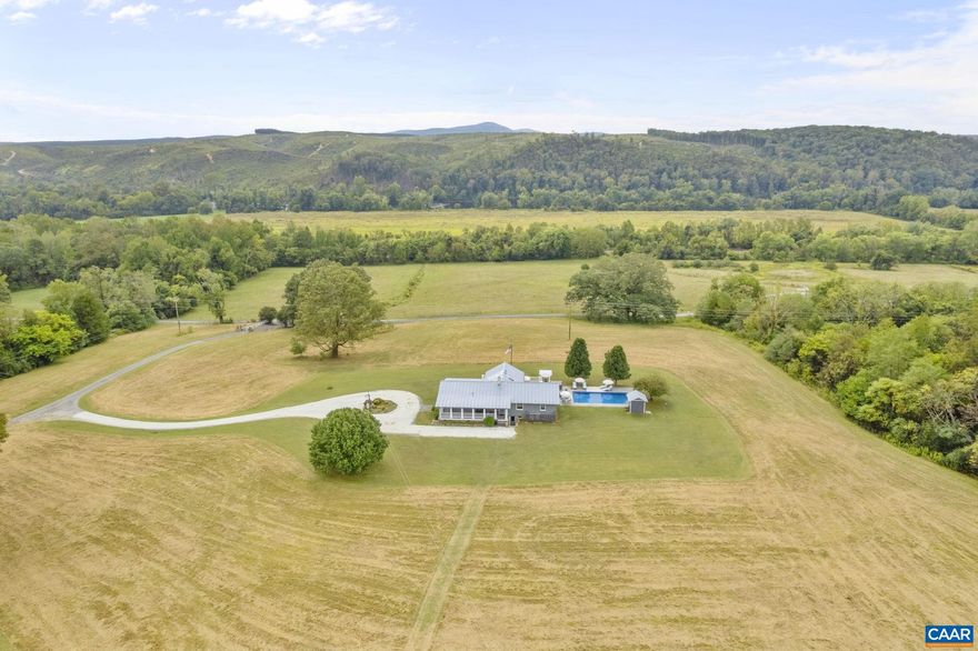 Robbin?s Nest Farm spans 212 acres with over 1/3 mile of James River frontage, offering a rare blend of natural beauty, income potential. and modern comfort. The main 3-bedroom plus lower level rec room and bonus/flex room residence features inviting living spaces, a sunroom, pool, and hot tub. Two additional homes?the historic brick guest house and a guest cottage attached to the stables?provide versatile options for short- or long-term rental income or farm manager. The farm is well-equipped for equestrian pursuits with a 14-stall stable, hay barn, and 4,000 sq. ft. concrete floor equipment shed. Fertile bottomlands, fenced pastures, rolling hayfields, 4 horse/RV trailer hook-ups, and wooded areas create endless possibilities for farming, livestock, or recreation. Private trails wind through the property, one of which leading to the James River with its private boat ramp and beach affording opportunities for excellent fishing, paddling, or quiet reflection. Whether envisioned as a working farm, sporting retreat, or private estate with built-in hospitality potential, Robbin?s Nest Farm offers scale, versatility, and unmatched river access.,Granite Counter,Fireplace in Family Room