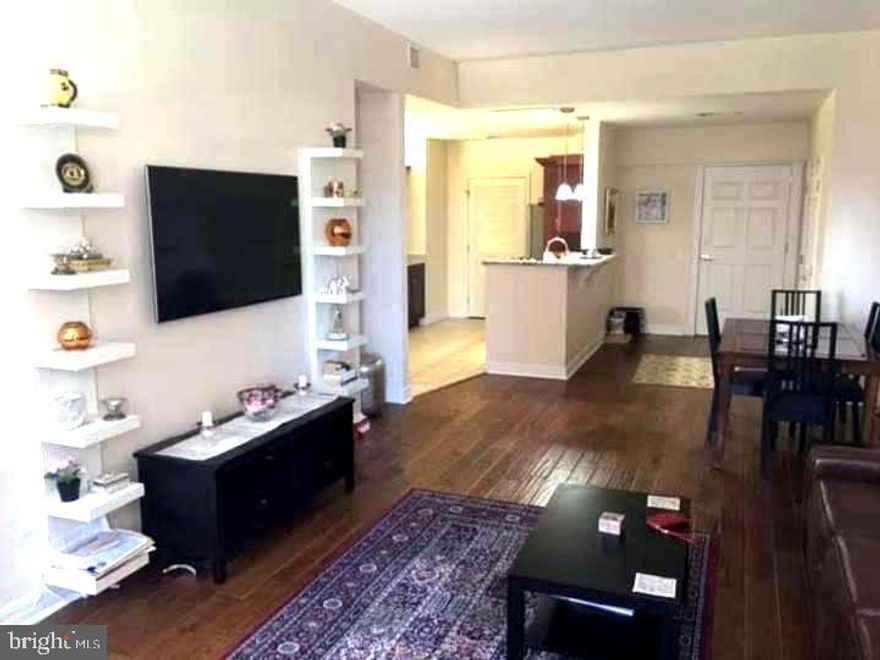 Gorgeous renovated one bedroom with views of The Benjamin Franklin Parkway. This unit features beautiful hardscraped floors, extended galley kitchen with granite countertops, Stainless steel appliances and pantry . Washer / dryer with storage area in unit. Master bedroom features 3 large windows that allow for great natural light. Nice size tiled bath with granite vanity. Just shy of 1000 sq ft. The Phoenix is a full amenity building with 24/7 concierge, fitness center, direct access to Suburban Station from residence elevator, media room and gorgeous roof top terrace with panoramic views of the city skyline. Close to all transpotation, Dilworth Park, and museums.