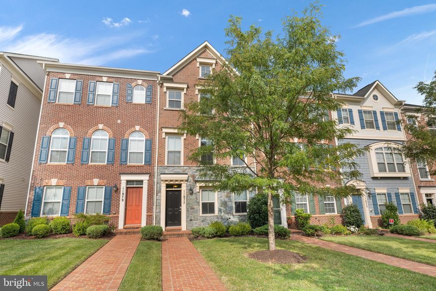 Welcome home to this Gorgeous updated townhouse 1 block from the shopping center and new elementary school! Easy access to commuter routes. Shows like a model!  Walk into the basement family room  from the front door. Perfect room to watch the game with friends or use as a playroom or home office. Basement also has a half bath for your convenience.  Walk upstairs to the main floor and relax in the generously sized  bright and airy great room that is open concept to the dining area that easily fits a table for 8  and the island kitchen which boasts Updated stainless steel appliances with a beautiful tile backsplash and granite counters, large island and ample pantry. Step outside onto the deck to enjoy your morning coffee or evening cocktail! The main floor also has a half bath. At last, wander upstairs to the primary bedroom with  vaulted ceilings, a closet that has a great storage system, and an ensuite bath with walk in shower and soaking tub, and double sinks all beautifully tiled.  2  additional bedrooms, hall bath and a laundry complete the upstairs. Extras include Nest Thermostat, Arlo security Cameras, shelving in garage, and hue smart lighting in living room and hall(great for parties and entertaining!)
 Dont miss this one, nothing to do but just move right in!