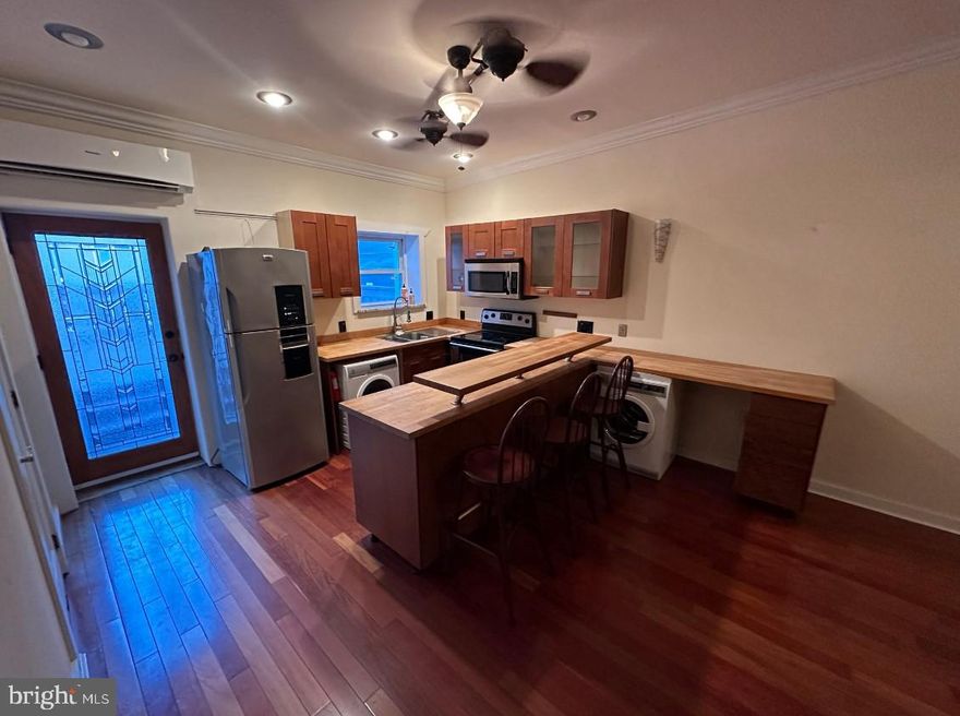 This recently renovated studio apartment is located on the second floor of the building just off the corner of Front Street and Girard Ave. Located within steps of all of the entertainment at Girard and Frankford Ave., you will absolutely love this location! This apartment is available for immediate move-in and we're accepting applications NOW!

This rare studio apartment in Fishtown is completely modernized and within steps of the El and trolley lines. Upon entry of the apartment is a number of hardwood steps in a wide staircase ideal for moving-in furniture! The studio consists of an extremely large living room with stunning hardwood flooring, tall ceilings and large windows which allow tons of natural light to pour in and make the entire space feel incredibly open and bright. Attached to the living room is a steel fabricated, elevated sleeping area that is perfect for a queen-sized mattress!

The entire north side of the apartment features an immaculate exposed brick wall which is a gorgeous sight in the living room and bathroom. The bathroom features a very modern vanity and a full-sized clawfoot bathtub/shower with an incredible tile surround. This bathroom truly feels like having a spa inside your own home!

The kitchen is completely updated with custom cabinets, butcher block countertops, stainless steel appliances, breakfast bar, and more! There is also a washer and dryer included with the apartment as well as a split zone system which provides cold and hot air!

In addition to all of the great features throughout the apartment, there is also a completely private deck located directly off the kitchen! With enough space for an outdoor furniture set, this is the perfect spot for outdoor entertainment. You'll have a very difficult time finding another studio in the city with this much outdoor space!

Conveniently located in Fishtown by the El at Front and Girard. Plenty of bars and restaurants within a 5-minute walk as well as Sugar House Casino! Easy access to Girard Ave., Delaware Ave., Frankford Ave, I-95, I-676, Penn's Landing, and much more!

Tenant is responsible for electric, gas (if applicable), water, and cable/internet in addition to rent each month. Pets permitted on a case-by-case basis with $500.00 refundable deposit!

Application Qualifications: Minimum monthly income is 3 times the tenant’s portion of the monthly rent, acceptable rental history, acceptable credit history and acceptable criminal history. More specific information provided with the application.