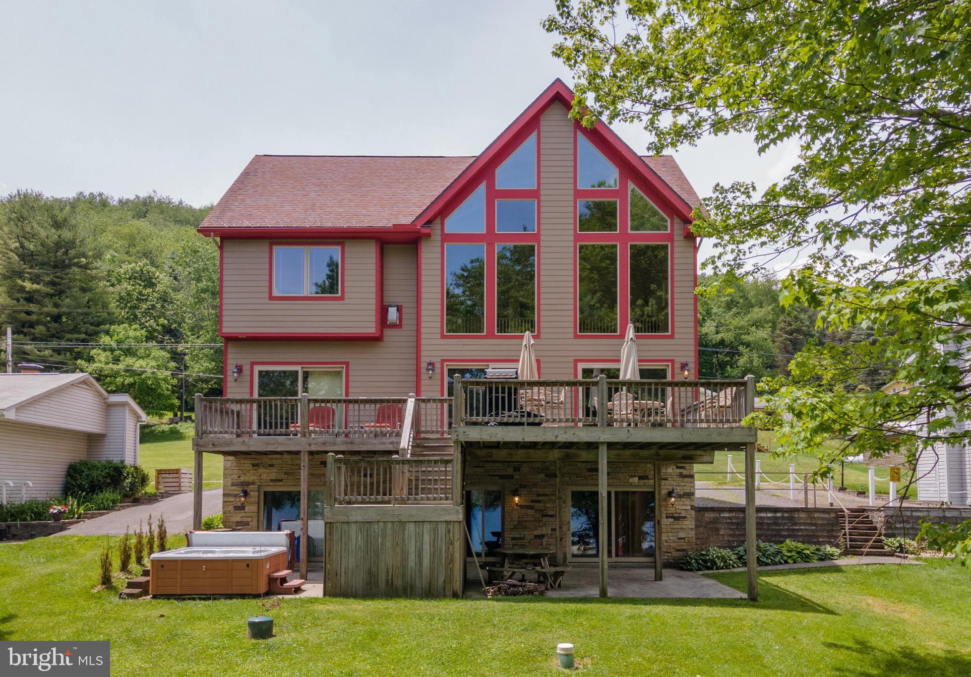 681 Marsh Hill Road offers pristine, level lakefront living in the highly desirable McHenry area of Deep Creek Lake! Located in the heart of the DCL, this home is situated just below Wisp Resort and is within minutes to all of the area’s premium restaurants and amenities. This exceptional 5 bedroom, 3 bathroom chalet home offers an open main level with one bedroom and full bath on the main level, two bedrooms and one full bathroom upstairs as well as two bedrooms and a full bathroom downstairs on over 3500 sq.ft of finished living space. This property includes one dock slip directly in front of the house. Enjoy eastern exposure from the lake side of the home, great for morning sunrises! Established vacation rental with Railey Vacations “A Shore Thing” with over $56,000 in bookings in 2023 with bookings continuing to increase each year! Exterior of home has recently been repainted. Call today for a private showing!