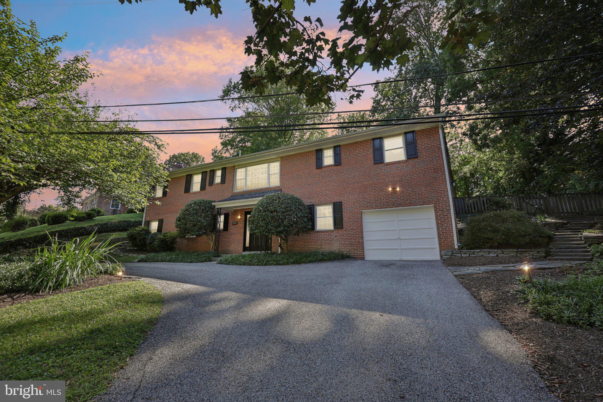 This elegant all-brick raised ranch in the coveted Rollingwood neighborhood of Chevy Chase offers 3,100 square feet of beautifully designed living space across two levels. The home has been well maintained and thoughtfully laid out to provide both comfort and flexibility. The lower level welcomes you with a spacious recreation room featuring a wet bar, along with a bedroom, full bath, utility and laundry rooms, and direct garage access. Upstairs, abundant natural light pours across hardwood floors, highlighting a seamless flow between the living and dining areas. The kitchen connects effortlessly to a sunroom that opens onto a professionally landscaped, low maintenance, and expansive backyard, perfect for enjoying the outdoors in every season. Two additional bedrooms and two full baths complete the upper level, creating inviting retreats with a sense of balance and privacy. The setting is just as appealing as the home itself. Residents enjoy close proximity to Rock Creek Park and its extensive trail system, offering miles of pathways for walking, running, or biking. Commuters benefit from easy access to the Beltway, downtown Bethesda, Silver Spring, and Washington, D.C., while nearby Metro stations provide further convenience. Parks, playgrounds, Meadowbrook Stables, and Meadowbrook Local Park are only minutes away, and a short drive leads to Bethesda Row with its mix of boutiques, dining, and entertainment. Combining classic architecture with sun-filled interiors and a coveted location, this home delivers a lifestyle that is both refined and connected, offering the perfect blend of indoor comfort and outdoor enjoyment.