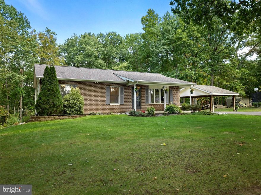 Amazing little rancher in the woods.  One level living with woods, trails, and a little wet weather stream.  The home is adorable with newer roof, windows, flooring, kitchen, and all cosmetic items.  Basement has been finished into large bedroom area, but could be a great rec room as well.  A bath would not be hard to add down there.  The outside has been very well manicured with cleared out front yard, mature trees, trails, bridges, and more.  Lot is well marked and we urge all viewers to take a hike!  Just start at the nice fire pit area and move around the back of the property.   This place is so private but yet super convenient to all local travel.  Home is not in an HOA, municipality, town, or city.  There are no restrictions..