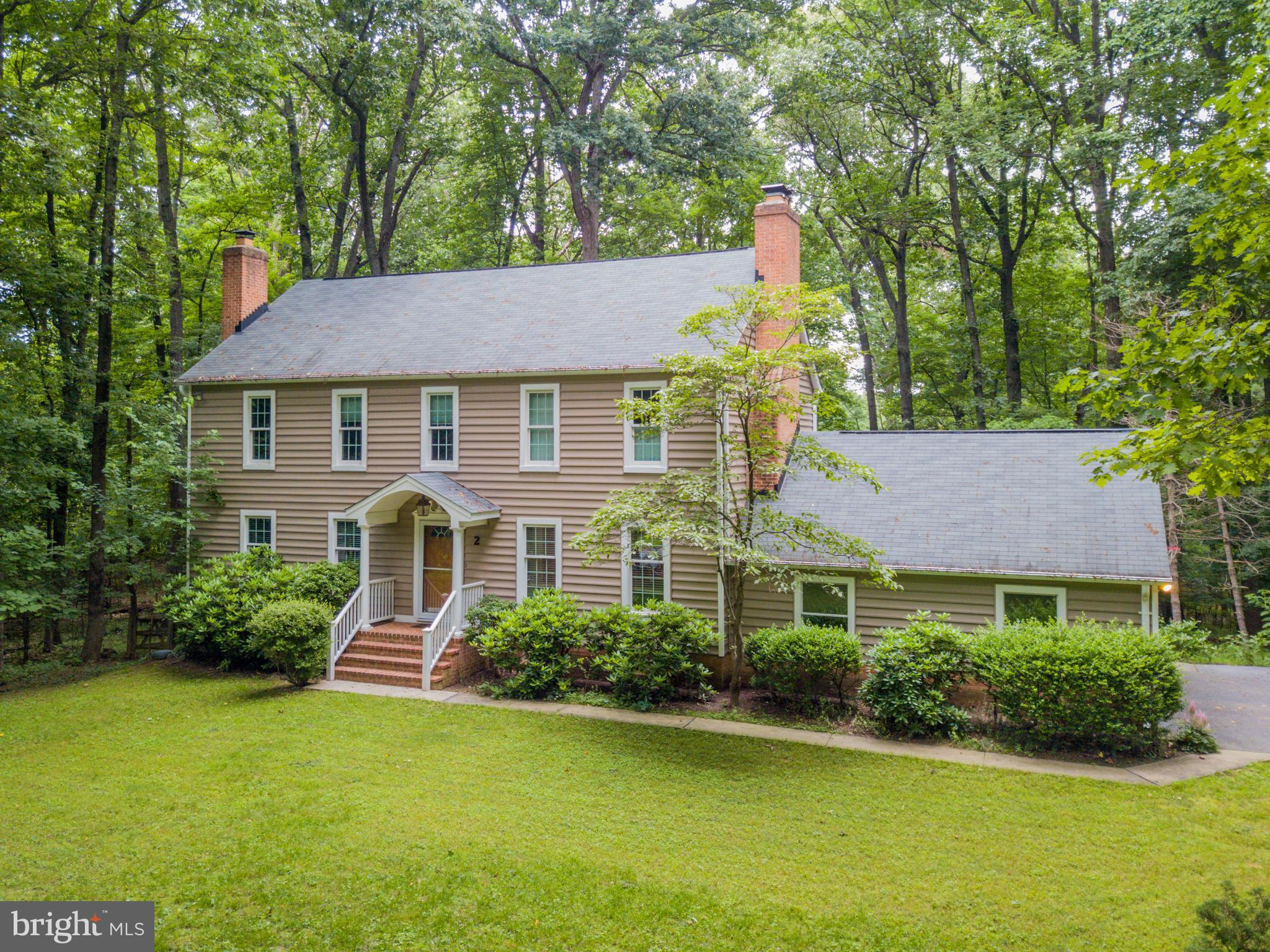 Beautiful Colonial on 1 Acre Wooded Lot, Fully Finished Basement/Perfect In-Law Suite w Wet Bar, Bedroom and Full Bath, Gorgeous Hardwood Flooring, Spacious Master Bedroom w Fire Place, Walk-in and Master Bath, Fenced Yard, Screened Deck.Main Level Family Room w Wood Burning Fireplace, Huge Formal Dining Room, Multiple Fireplaces Seller Updates Include: New Septic Drain Fields, Windows, Kitchen Appliances, Granite Counters, Refinished Hardwood Flooring, Vinyl Siding.
