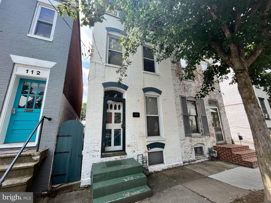 Aggressive price reduction !  Brick semi-detached 2 story with deep fenced rear yard and patio.  Ample sized living room and dining room. Some period trim work and fireplace mantel still remain.  Upper level features 2 bedrooms + dressing room or office adjacent to full bath.  Walk to downtown restaurants and Baker Park !