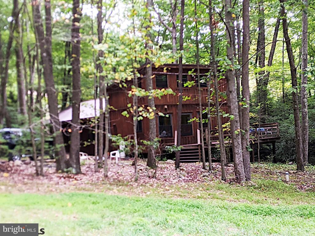 A unique opportunity indeed! This 37 acre property comes with a lovely Applehouse converted home, a beautiful cabin with all the basic amenities, and additional apartment & storage in the __x__ outbuilding! Enjoy a slice of solidarity conveniently located just off route 192 in Spring Mills. The cabin features a wrap around porch, full kitchen, full bath, stone fireplace, plenty of natural light, and a stream adding peace & tranquility. The Applehouse is equipped with a full kitchen, full bath, 3/4 en suite bath, laundry/mudroom, and large deck. Other features of the property include a pond, orchard, storage shed, electricity, well (supplies the cabin & the Applehouse), septic & sand-mound systems.