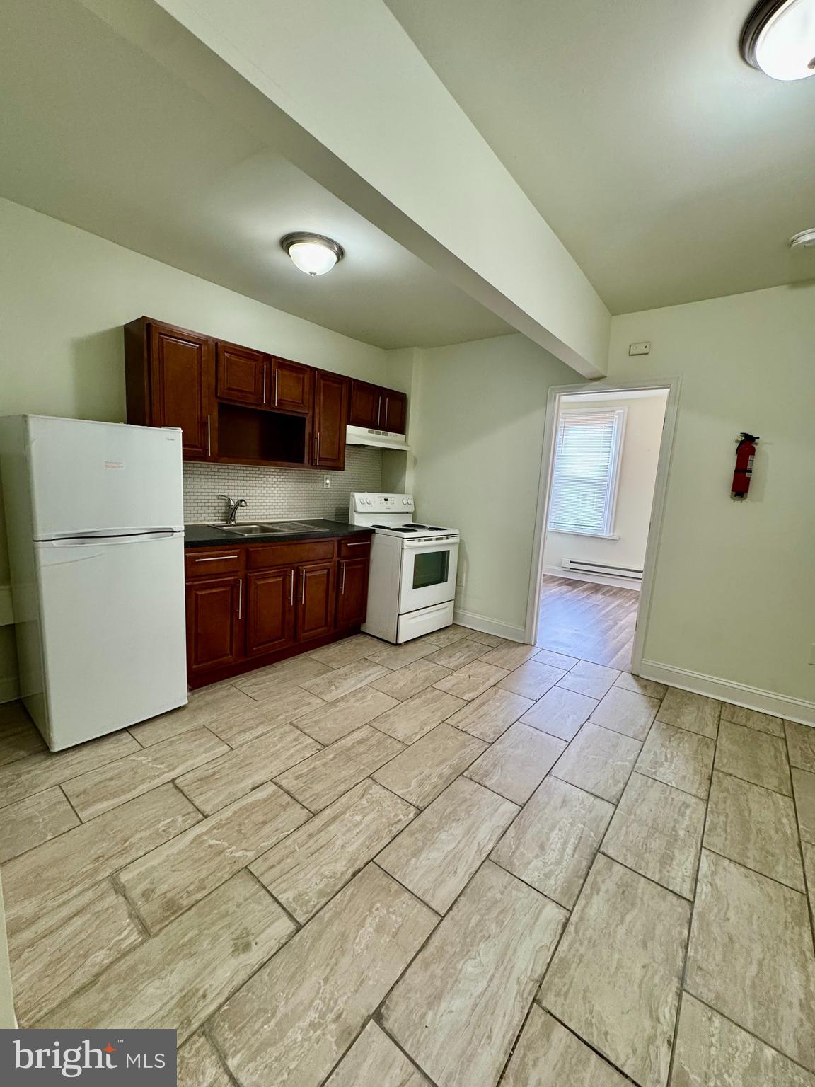 Live at 1659 N 5th St #3 and enjoy this updated 1-bedroom, 1-bathroom apartment in the Overbrook section of West Philadelphia. The apartment features a modern, tiled bathroom, a spacious bedroom with brand-new carpet, and large windows for great natural light.
The kitchen and living area offer upgraded finishes, plenty of cabinet space, and an open, comfortable layout. Pets are welcome.
Contact us today to schedule a showing!