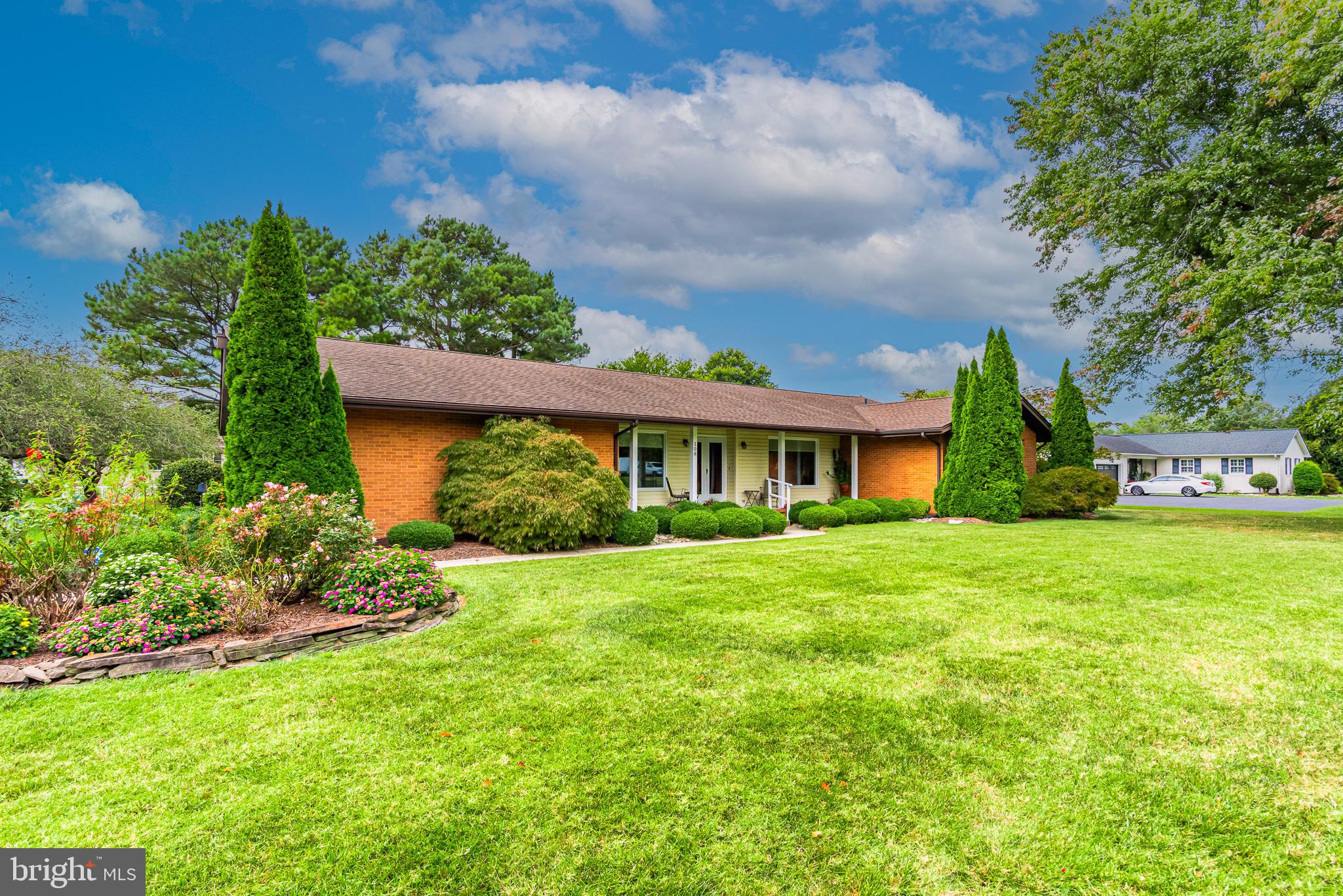 Discover the charm of living in the historic town of Berlin, known as the “Coolest Small Town in America!” Live life to the fullest on the Eastern Shore, with a short distance to Ocean City MD and Assateague National and State Seashores!
This exquisite property is on a 0.77-acre lot with two large sheds. The home is approx. 2630 sqft. Elegant landscaping with goldfish pond and gardens. Ground level paver patio is perfect for entertaining and dining outdoors.
Stunning floor plan with impressive living room and family room combination with wet bar for large gatherings and entertaining, as well as a wood-burning fireplace and built in bookcase. Formal dining room. Plenty of sunshine enhanced with over-sized windows throughout, sliders, and a bonus three-season room with built-in grill. Kitchen is equipped with stainless steel appliances, pantries, custom cabinets, and spacious eating area. Utility room with washer & dryer and plenty of shelf space.
Grand primary suite with full private bathroom and a sitting room with gas fireplace. The second primary suite is also extensive, with an en suite bathroom and walk-in shower. Both have large walk-in closets.
A third bedroom has a queen murphy bed.
Over-sized two car garage.