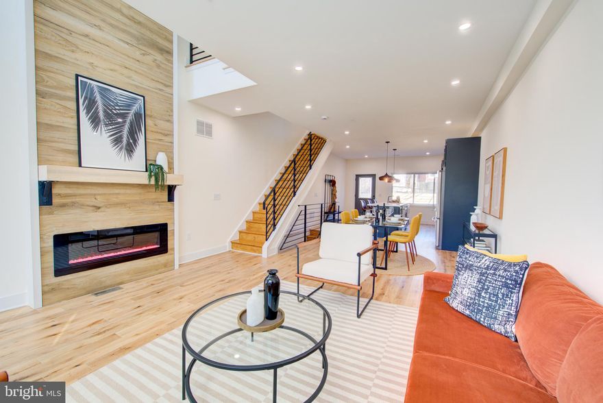 Presenting an exquisite new construction corner townhouse located in the vibrant city of Philadelphia! This contemporary 3-story home is a masterpiece of modern design, featuring white oak hardwood floors that grace every level. With 5 bedrooms and 3 full bathrooms, this home offers ample space for comfortable living. 
The open floor plan creates a seamless flow throughout the residence, ideal for both everyday living and hosting gatherings. A striking highlight of this home is the second-floor overlook, offering a captivating view of the first floor. Natural light pours in through the atrium window, illuminating the space and highlighting the elegant chandelier. 
The living area boasts an impressive accent wall of wood, complemented by a built-in fireplace and natural wood shelving, creating a cozy and inviting atmosphere. A formal dining room and the culinary delights of the gourmet kitchen  where every detail has been meticulously designed for both style and functionality. The kitchen features a spacious island, elegantly crafted with quartz countertops, providing seating for three and creating the perfect space for casual dining or entertaining guests while you cook.The state-of-the-art appliances, including a built-in microwave, hood range, and refrigerator, elevate the kitchen to a new level of luxury. The wood cabinetry adds a touch of warmth and sophistication, offering ample storage space for all your culinary essentials. A built-in trash bin discreetly tucks away waste, maintaining the kitchen's seamless aesthetic.
When it's time to unwind, step outside from the kitchen to the massive backyard, where you'll discover a sprawling outdoor space that beckons for relaxation and entertainment.  
The second floor invites you to experience comfort and style with two inviting bedrooms and a fabulous hall bathroom. Each bedroom offers a peaceful retreat, featuring thoughtful design elements and ample natural light, creating a serene ambiance for rest and relaxation.The fabulous hall bathroom exudes elegance with its wood accents, adding a touch of warmth and sophistication to the space. Convenience meets luxury with the addition of a separate laundry room on the second floor. 
Ascend to the third floor and discover the epitome of luxury living within the master suite. This private sanctuary beckons with a spacious sitting area, enveloped by a plethora of windows that invite natural sunlight. A generously sized walk-in closet, providing ample storage space for your wardrobe and personal belongings.Step into the dream bathroom, where royal porcelain tile flooring and shower walls exude opulence and elegance. The walk-in shower is large enough to accommodate a soaking tub, perfectly positioned next to a window, allowing you to bask in natural light as you indulge in a luxurious bath. 
As you make your way through the hallway, you'll encounter a delightful surprise—a wet bar that adds a touch of convenience and sophistication to the space. This thoughtful addition enhances the allure of the master suite, offering a perfect spot to prepare a refreshing drink before stepping out onto the rooftop deck.

The finished basement adds versatility to the home, with 2 additional bedrooms and a full bathroom featuring a walk-in shower and a stylish wood bathroom vanity. This exceptional townhouse combines contemporary luxury with functional design, offering a unique opportunity to experience the best of city living. Don't miss out on the chance to call this remarkable property your new home!
Not ready to be a home owner, well this beautiful property would make a great investment property with corporate short or long term tenants. Their is a management   co inpace to handle everything.