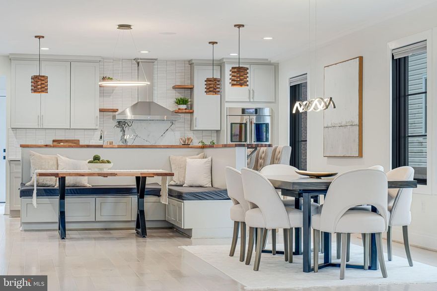 Welcome to The Modern Clarendon, a newly built 6-bedroom, 6-bath luxury home offering 4,450 sq. ft. of modern elegance across four levels in the heart of North Arlington. Designed for both style and functionality, this home features a private elevator, two balconies, and a stunning open floor plan. The gourmet kitchen is a chef’s dream with exotic quartz countertops, built-in seating, top-tier appliances, and a massive island perfect for entertaining. The primary suite offers a spa-like en-suite bath and a spacious walk-in closet, while the lower-level in-law suite includes its own kitchen and laundry, ideal for multi-generational living or rental potential.

High-end finishes throughout include ¾-inch Red Oak solid hardwood floors on all three levels, custom one-piece Dekton fireplace surrounds, Nest thermostats, and Bluetooth speakers on three levels. The home is fully equipped with two laundry rooms and light-filtering shades. Outside, enjoy a private paver patio and an outdoor theater featuring a retractable projector screen and bench seating. The fenced yard ensures privacy, and the rear-entry detached 2-car garage includes a high-quality Level 2 EV charger.

Located just minutes from Clarendon Metro, this home offers unbeatable access to boutique shopping, top-tier dining, vibrant nightlife, and major commuter routes. Don’t miss this one-of-a-kind new construction home, blending luxury, convenience, and innovative design in one of Arlington’s most sought-after neighborhoods.