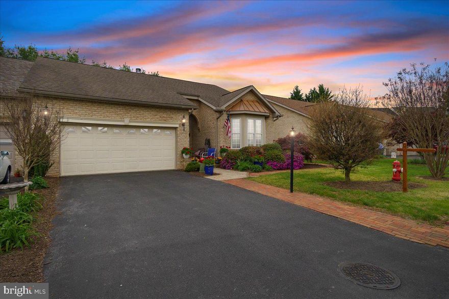 Nestled in one of the most desirable neighborhoods of WV's Eastern Panhandle, this stunning villa offers the perfect blend of elegance, comfort and convenience. From the moment you step inside, you’ll be captivated by soaring high ceilings that create a bright and airy ambiance throughout the home . Inviting ceramic floors  greet you in the foyer as you appreciate the open interior concept with large crown molding throughout.  A vaulted ceiling and hardwood flooring adorn the owner's suite that features a step in spa/tub and generous walk in closet within the owner's bath. Kitchen updates include newer stainless appliances and features ceramic flooring and storage pantry.  A propane fireplace is conveniently located in the middle wall between the living and family room area. Oversized single car garage and ample driveway parking. The Spring Mills community walking paths and outdoor recreation facilities are close by.  Located just minutes from commuter routes, this villa combines upscale finishes with low-maintenance living in a prime location. Don’t miss the opportunity to make this exceptional home your own!