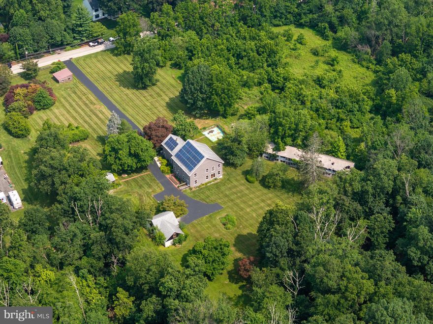 Stunning rare 8-acre sanctuary next to Evansburg State Park with 3300 acres and just minutes from major amenities, yet worlds away in peace and privacy. This extraordinary off-grid-ready property offers a harmonious blend of nature, sustainability, and thoughtful design. Horse stalls, a detached office building, and subdivision potential truly set this property apart. 

At the heart of the property is a spacious 2-level home with over 3,500 square feet of living space, seamlessly combining rustic charm and modern convenience. The original 900 sq ft pine-paneled cottage, rich with character, was beautifully expanded in 2012 with a 2,400 sq ft custom-built addition featuring 2x6 construction, spray foam insulation, Red Oak hardwood floors, 9-foot ceilings, and oversized double-hung, double-glazed windows to flood the home with natural light. 

Enjoy flexible living spaces designed for both relaxation and entertaining. A sun-drenched main-level living room opens up to serene forest views — the perfect spot for morning coffee. Upstairs, a spacious entertainment room with a wet bar and pool table offers the ultimate game-night experience.

The home boasts five spacious bedrooms, ceiling fans throughout, insulated floors, and energy-efficient upgrades including solar panels, a tankless combination water heater, baseboard hot water heating,  and central air conditioning—keeping utility costs low and comfort high all year round. Off-grid systems including a well, septic, and net-positive solar capacity empowers self-sufficient living.

Step outside and immerse yourself in the surrounding natural beauty. Watch foxes, herons, red-tailed hawks, and deer roam through the mature woodlands, magnolia trees, flowering shrubs, and thoughtfully planted perennial gardens — including iris, peonies, roses and in the spring, 60 feet of blooming daffodils.

Equestrian enthusiasts or hobby farmers will appreciate the two horse stalls in the detached garage, which also features a large upper-level storage area. For remote work or creative projects, a detached 16'x30' outbuilding serves as a fully functional office or studio space.

An incredible added value: the 3-acre subdivision has already received conditional township approval, offering the opportunity for resale, a future build, or expanded living options.

All this just a short drive from Philadelphia and within reach of the Jersey shore/New York City (2 hours) and Washington D.C. (3 hours).

This is not just a home — it's a lifestyle.   Come experience the serenity, sustainability, and potential to fulfill your aspirations.  Schedule your private tour today.
The Seller requires all offers to purchase this property to include a complete and signed "Buyer's Financial Statement" (BFI) and for all "NON-CASH" offers a Mortgage Pre-approval Letter from a reputable Mortgage Company.