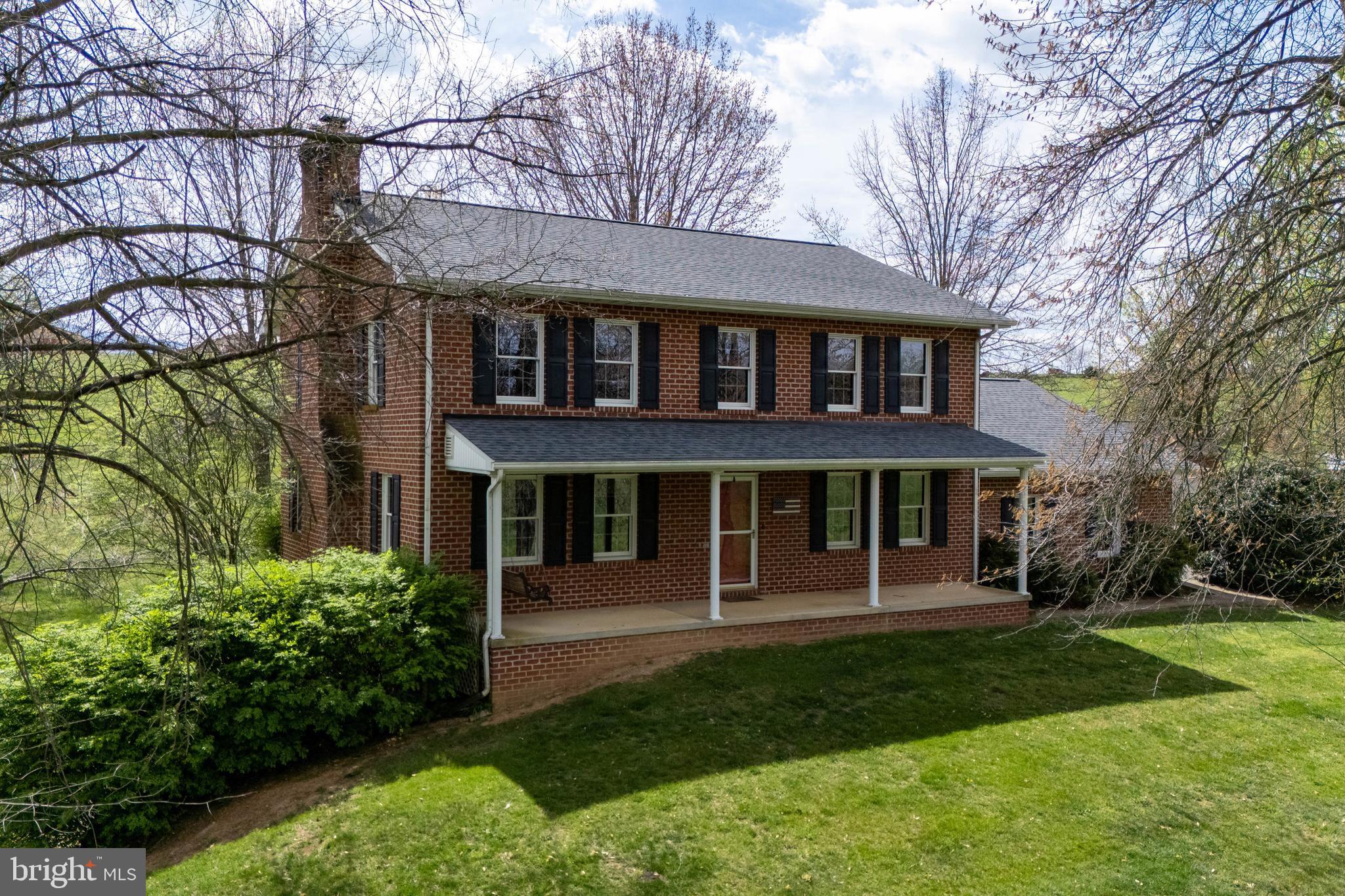 Charming 3 Bedroom, 2.5 Bath, 2-Story Brick Colonial with Stunning Views.
This beautifully maintained brick colonial home located on 7.53 acres, more or less, offers timeless elegance with modern comfort. Featuring two spacious stories, the property boasts breathtaking views and well maintained grounds perfect for relaxing or entertaining. Kitchen with tile floors and stainless steel appliances, dining and family rooms with hardwood flooring, living with gas logged fireplace, chair rail and hardwood floors, central vac, and 2 heating systems which include heat pump with central air approx 3 years old, and oil hot water baseboard, full unfinished basement and plenty of parking room in the 3 car attached garage and 2 car detached garage. Well maintained property with updates to include new roof in November 2024, septic inspected and pumped in 2022 and new heat pumps approx 3 years old.