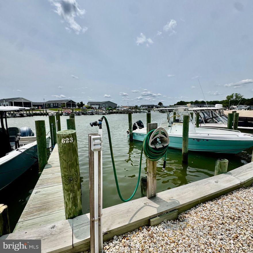 BOAT SLIP-New Stainless Refrigerator and flooring in sunroom as of 12-10-2025-Coastal Living at Its Finest – Waterfront Home in Pot-Nets Bayside with Boat Slip, Sunset Views & Rare 2-Car Garage

A very rare find in the community, this property includes a spacious 2-car garage—ideal for storing vehicles, beach gear, or water toys. It also comes with two golf carts, making it easy and fun to explore the neighborhood, head to Paradise Grill, or spend the day at one of the multiple community pools.

Nestled in one of the most sought-after communities at the Delaware beaches, this stunning 3-bedroom, 2-bathroom home in Pot-Nets Bayside offers the perfect blend of luxury, comfort, and coastal charm. Located just steps from your private boat slip and only 50 feet from the tranquil lagoon, this double-wide manufactured home features breathtaking sunset views from a spacious 41-foot waterfront deck and an all-season sunroom.

Spanning 1,792 square feet, this home was thoughtfully designed for modern living and entertaining. The open-concept layout connects a large living area with a remodeled gourmet kitchen, complete with stainless steel appliances, upgraded countertops, and a large island perfect for meal prep or gathering with friends. The dining area, adorned with a large dining table and recessed lighting, flows seamlessly into the living room.

The primary suite is a true retreat with a walk-in closet and a spa-like bathroom offering dual vanities, a soaking tub, and a stall shower. Two additional bedrooms and a second fully renovated bath provide ample space for guests or family.

Natural light pours in through bay and bow windows and skylights, while ceiling fans and custom window treatments provide year-round comfort. The home comes fully furnished, so you can move right in and start enjoying the lifestyle you deserve.

Outdoor living is elevated with a massive 41 foor deck, 17 x 9 enclosed porch, BBQ area, and secure storage for all your gear. A private asphalt driveway fits additional vehicles with ease.

Living in Pot-Nets Bayside means enjoying exclusive access to resort-style amenities, including waterfront dining, private beaches, walking trails, and more. Whether you’re an avid boater, beach lover, or just seeking a peaceful retreat, this home truly has it all.

Key Features:

Rare 2-Car Garage – Plus private 4-car driveway
Includes 2 Golf Carts – Easy access to Paradise Grill & pools
3 Bedrooms / 2 Bathrooms – Both recently remodeled
1,792 Sq Ft – Spacious, open layout
Waterfront with Private Boat Slip �� 50 feet from the lagoon
41-Foot Deck + All-Season Room – With sunset views
Fully Furnished – Move-in ready
Community Perks – Pools, Paradise Grill, private beach, and more
Built in 2001 – Impeccably maintained and updated
Don’t miss this rare opportunity to own a waterfront oasis in the heart of Pot-Nets Bayside. Schedule your showing today and experience the best in coastal living.