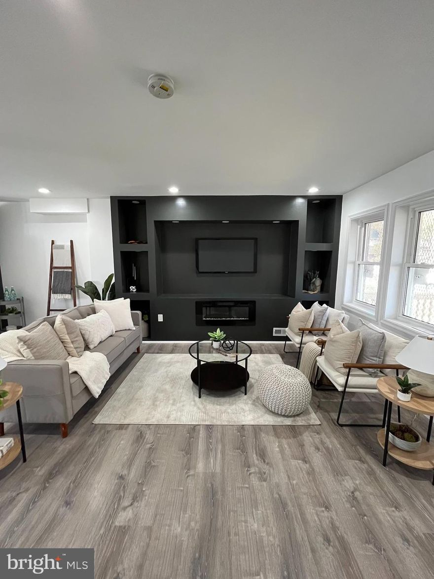 Welcome to this beautifully renovated 3-bedroom, 3-bathroom home that seamlessly blends modern elegance with timeless charm. Nestled in a quiet and desirable neighborhood, this property offers the perfect combination of comfort and style.

As you step through the front door, you'll be greeted by an open-concept living space bathed in natural light. The spacious living room features gleaming hardwood floors, a built in entertainment wall for Tv and Fireplace, and large windows that provide a warm and inviting atmosphere. Adjacent is a formal dining area, perfect for hosting family gatherings and dinner parties.

The kitchen is a true chef's delight, boasting high-end stainless steel appliances, granite countertops, custom cabinetry,  Custom backsplash, beautiful pendant lights, and a large island with bar seating. Whether you're preparing a casual breakfast or a gourmet meal, this kitchen is sure to impress.

The three bedrooms are generously sized and offer plenty of closet space. The master suite is a true retreat with an ensuite bathroom that includes a custom title, and fixtures. The other two bathrooms are equally well-appointed with modern fixtures and finishes.

This Home is Eligible for Vacant To Value grant up to $10k!!  This home is ideally located, close to schools, parks, shopping, and dining. It's a rare opportunity to own a meticulously renovated property that combines the best of contemporary living with classic appeal. Don't miss your chance to make this house your forever home. Schedule a viewing today and experience the magic of this exceptional property for yourself.