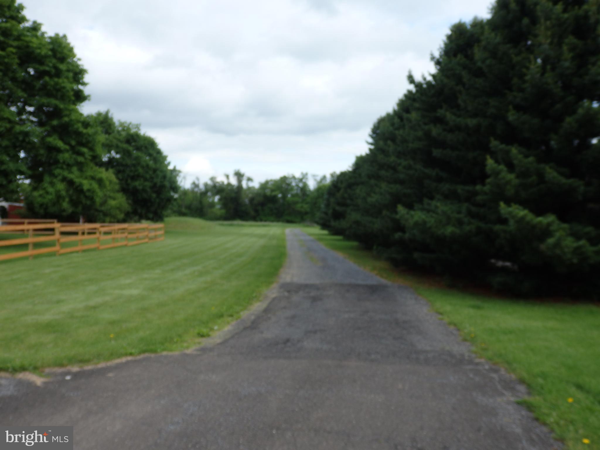 Open and Flat Lot in Milford Township Bucks County. 2.2 acre flag lot in RA -Residential Agricultural District. Driveway can be run next to the current neighbor's driveway. Tucked back Trolley Bridge Road to build your dream home with beautiful views of the country. Trolley Bridge Road is located in Upper Bucks County and provides easy access to the Lehigh Valley and Minutes away from 476 PA Northeast Extension. By appointment only and must be accompanied by a real estate agent.
