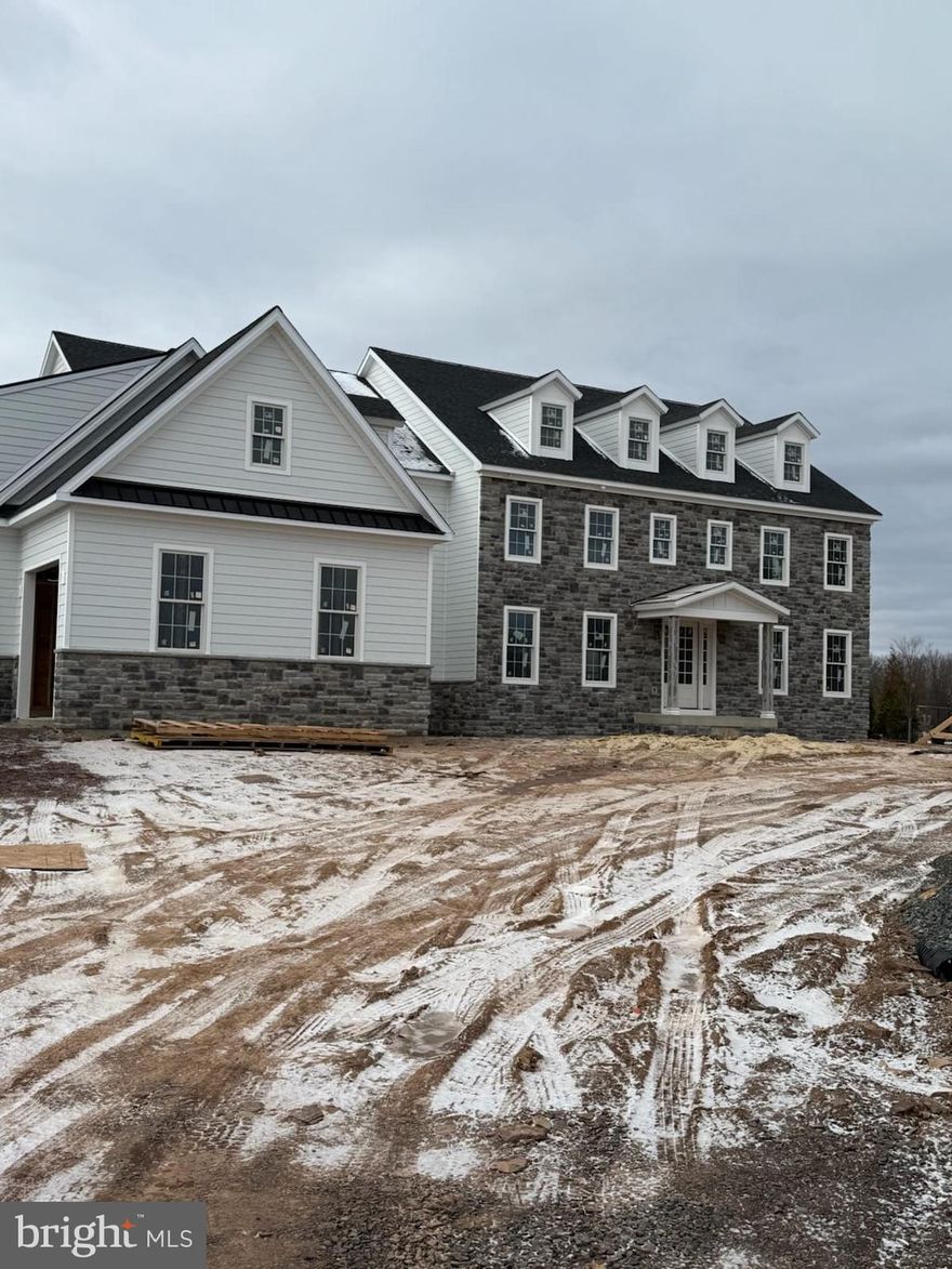 High-end New Construction! M Gold Building Group presents quality built 3-Story Custom Colonial with
7200 sq ft of living space. Stone-front Colonial on a 2-acre lot with incredible views of Lake Galena! 2x6 construction, Anderson 200 series windows, Hardi Plank Siding, 50-year Tamco high definition roof, and metal roof on front & side entry pent roofs. Covered front entry to 2-story foyer with custom oak staircase to 2nd floor opens to formal Dining room w/tray ceiling and cust coffered ceiling and formal Study off the Foyer with double glass French doors. 9' ceilings  & custom millwork throughout. The foyer opens into both the gourmet Kitchen and the magnificent 2-story Great room with coffered ceiling, and a floor-to-ceiling stone gas fireplace with a raised hearth facade. Great rm overlooks the gourmet Kitchen with mudroom access from a covered side porch. The Kitchen features custom cabinetry from Century kitchens, commercial grade stainless steel appliances including a 72" commercial refrigerator, built-in microwave & commercial grade stove with vented hood & pot filler. Custom tile backsplash, Butler's pantry with separate dishwasher, and full sink with quartz countertops. Huge custom center Island seats 6. Luxury bathrooms throughout with custom seamless glass doors to walk-in showers w/ bench and handheld sprayers, tile floors & surround, quartz top vanities. 2nd floor features 4 Bedrooms all with ensuite bathrooms & walk-in closets. The Owner's Suite features a coffered ceiling, custom lighting, and a separate sitting room. Gorgeous Owner's Bathroom with huge walk-in shower with seamless glass door, overhead rain shower, and bench with separate hand-held sprayer, free-standing tub & dual vanities. Access to a large walk-out fiberglass deck with black aluminum railings with a view of Lake Galena.  The 3rd level features a 30x15 5th bedroom with hardwood floors and full bathroom. Full, partially-finished basement with separate full bathroom, bonus room & luxury vinyl plank flooring. The Basement features walk-up stair access to ground level.  3 -Car garage with Clopay carriage house-style doors. 4-zoned gas heat and central air. 2 separate instant hot water tanks.2nd  Custom oak staircase off kitchen /mudroom. luxury throughout!