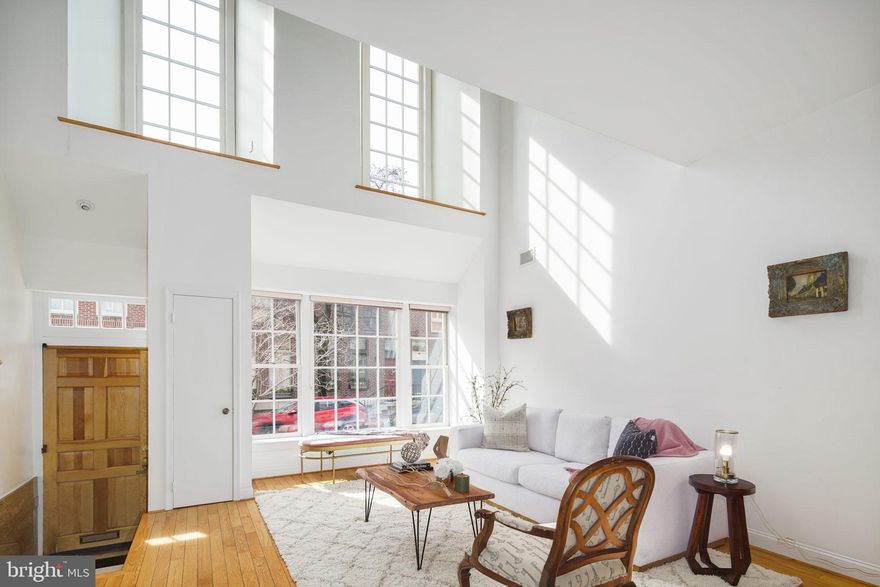 Soaring, loft-like, light-filled spaces with clean,  contemporary lines in a prime Society Hill location! This 3 bedroom, 3.5 bath home includes hardwood floors, a fabulous garden, large deck, huge den and a spacious eat-in kitchen.  The exceptional design provides for grand entertaining as well as for comfortable living. 1st fl-entry foyer leads  to an open floor plan featuring a dramatic living room / dining room with hardwood floors, large south facing windows emitting wonderful  natural light, a coat closet, powder room, and an eat-in kitchen with a skylight and glass doors to the beautiful garden. 2nd fl- the entire floor is a huge, open great room ( could also be used as an additional bedroom). It overlooks the living room and includes a granite fireplace, hardwood floors, a large window viewing the garden and a  glass tiled bath with a walk -in shower. 3rd fl-Two bedrooms with hardwood floors - the rear bedroom boasts a great deck with sensational views.  The hallway offers a full bath with double sinks, a linen closet and an extra clothes closet. 4th fl- large dormer style bedroom/ office with a skylight, hardwood floors and bath with a walk-in shower. The basement features a laundry with a w/d and lots of storage . 2 zoned heat/AC. Spectacular space within easy access to the amenities of city living- Walk Score 99,  Transit Score 96.