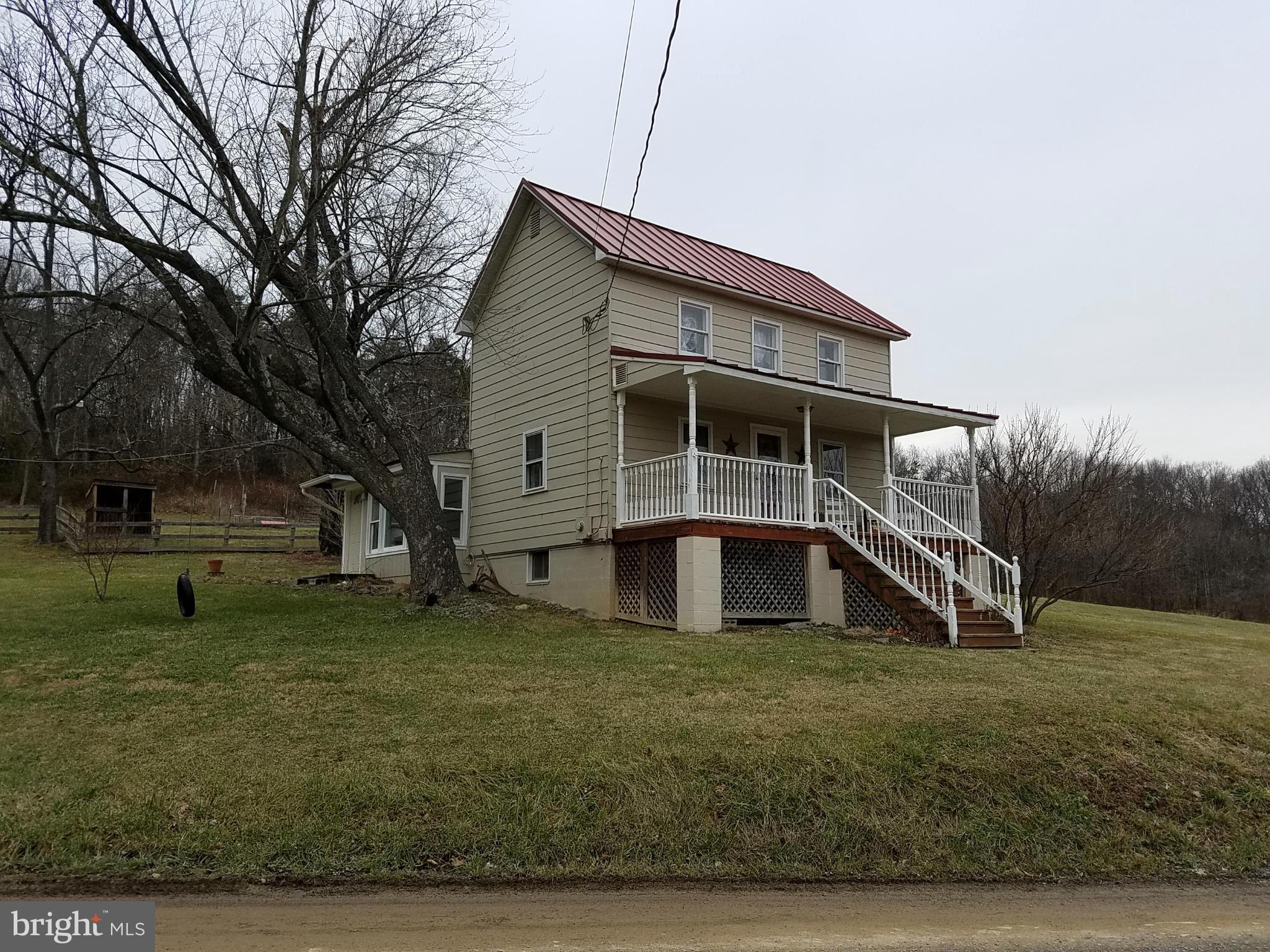 Beautiful property! Charming 2 story farmhouse with hardwood floors & a nice front porch for country evenings. 2 car 32x24 garage, 3+ acres open, pond, bring your horses! 4 tracts totaling 7 acres and comes with an additional one room cabin with well!
