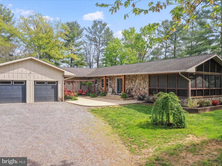Welcome to 2671 Parshall Rd, Berryville, Virginia, a picturesque property offering a blend of modern amenities and country living. This expansive 4,200 square foot home is situated on a 5-acre lot, featuring both wooded and open yard spaces, including a fenced area for your furry friends!

This inviting residence has 3 bedrooms, 4 bathrooms, and additional office space with plenty of room for family and guests. Designed for comfort and entertaining, the open floor plan seamlessly connects to a generous kitchen—perfect for hosting gatherings. Unwind with your morning coffee or relax in the evening on the expansive screened porch, where you can enjoy the sounds of nature.

Constructed with SIPs panels, the home offers superior energy efficiency and durability. A climate-controlled garage ensures your vehicles and storage items are well-protected year-round. Additional features include a 1,000-gallon propane tank, a furnace humidifier, and a whole-house generator, ensuring comfort and reliability in all seasons. The home is designed with handicap accessible doorways and hallways, providing ease of movement for all residents.

A unique aspect of this property is the mother-in-law apartment, which can also serve as an Airbnb offering income-producing potential. There is even an extra washer/dryer in the garage to accommodate! The Shenandoah River and public boat landing, less than a mile away, provides opportunities for outdoor activities and relaxation.

This property combines the best of rural charm and modern convenience. Whether you are seeking a peaceful retreat or a versatile investment, it's a unique opportunity to own a piece of Clarke County’s natural beauty. 

Pool Table conveys; Pergola conveys.  Electric Hoist in garage does NOT convey.