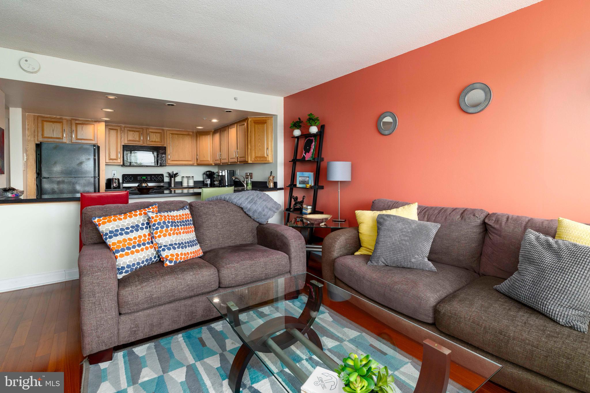 This condo has it all, COVERED PARKING, outdoor pool and beautiful courtyard, fitness center and 24 hour door person in a secure building located in the desirable neighborhood of Fairmount, close to everything you need including The Philadelphia Museum of Art, The Barnes Foundation, Kelly Drive and Boathouse Row, Whole Foods and Target as well as tons of other small boutiques and restaurants. Enter into the beautiful lobby that features a 24 hour door person as well as the in house management company for your convenience. Head up to the 9th floor and you will see this updated condo that is truly unique in the building. The open kitchen with breakfast bar is like none other at Cityview with tons of storage and great counter space as well as a built-in beverage fridge perfect for entertaining. The living room/dining room is open and features great natural light with the window wall that gives beautiful views of Fairmount. The guest room is large enough to have a bed and a desk for those who work from home as well as fantastic storage in the large closet. The large primary bedroom features an impressive walk in closet and great natural light. The beautiful bathroom has been updated and is spacious. The hall closet is perfect for linens and overflow and the coat closet in the foyer is also large enough for extra storage. Laundry is a few doors down the hall for your convenience. The seller has taken great care of this condo and is sad to go as she loves the building but it's time to pass it along to the next owner to love it. Make an appointment today for this beautiful condo at Cityview.