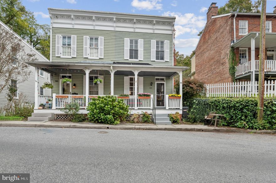 Fall in love with this historic home right in the heart of Oella. This home has the modern conveniences with historic charm.  The natural light floods this house! The large kitchen is a chefs dream with stainless steel appliances, granite countertops, and beautiful cabinetry. Check out the under and interior cabinet lighting. The kitchen also has brand new LVP flooring. As you continue through the home, you will find a spacious dining room as well as a large family room with gleaming hardwood floors. As you head upstairs, you will note the three bedrooms and two full baths. All the bedrooms have stunning hardwood floors. The primary bedroom includes a rare en-suite and large closet!  The back entrance has ample parking and a new stone patio, a perfect place to sit and enjoy time around a fire pit. Sit on the front porch and watch the fall foliage begin to change and the many people walking down the hill to historic Ellicott City or taking a short drive to Main Street in Catonsville. New carpeting, new LVP, newer A/C. Home is close to all commuter routes, shopping and restaurants. Schedule your private tour today!